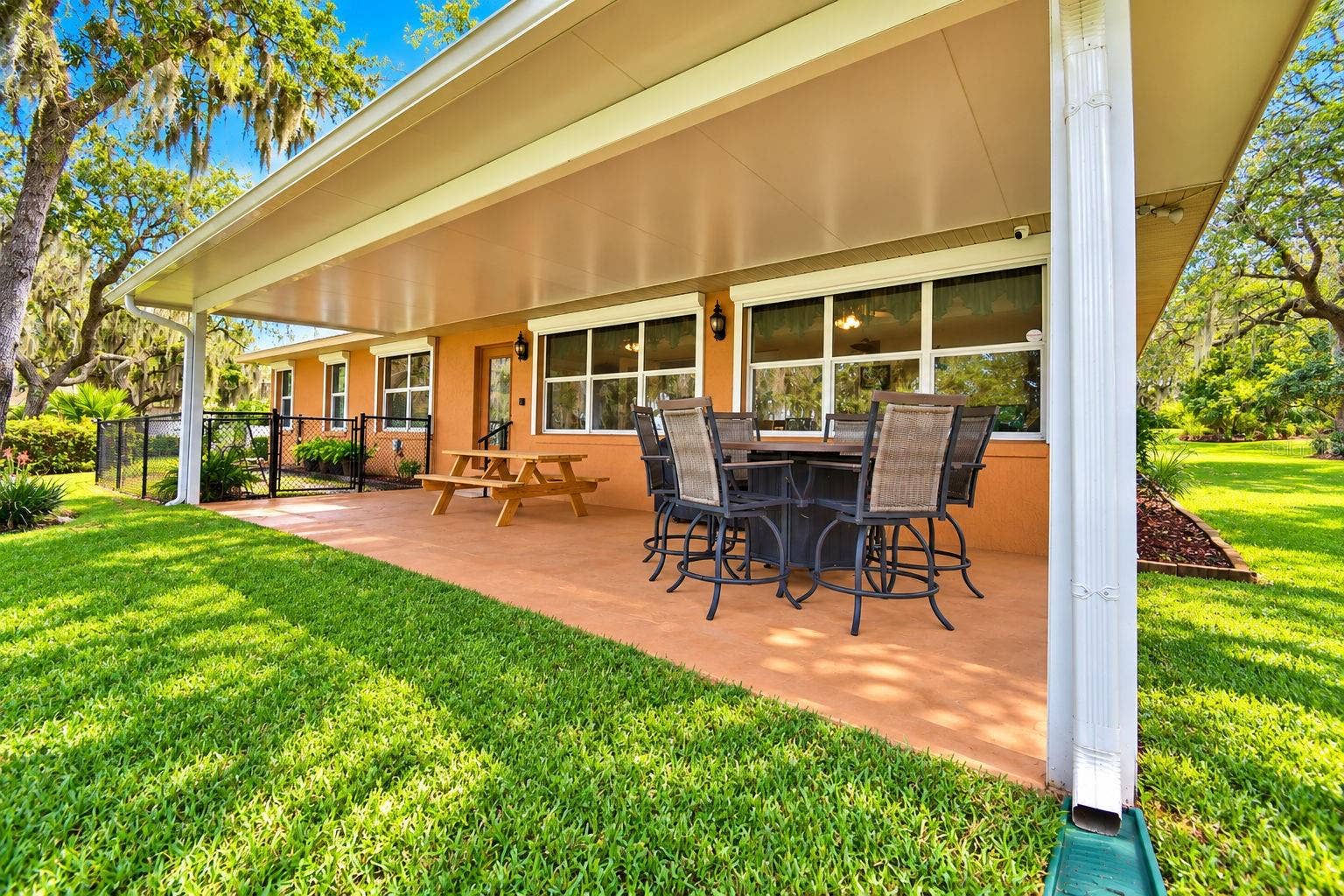 2391 S LAKE REEDY BOULEVARD, Frostproof, FL 33843 Open back patio with fenced dog run