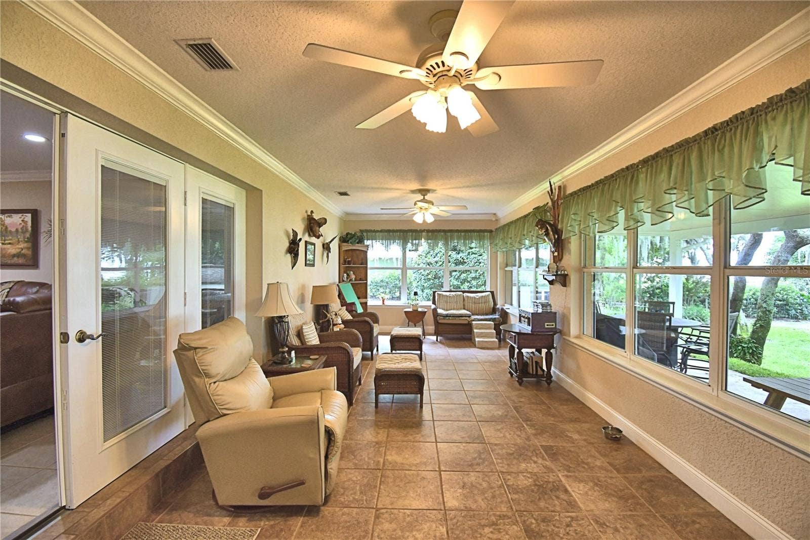 2391 S LAKE REEDY BOULEVARD, Frostproof, FL 33843 FL Room, wall of windows, view of lake & AC