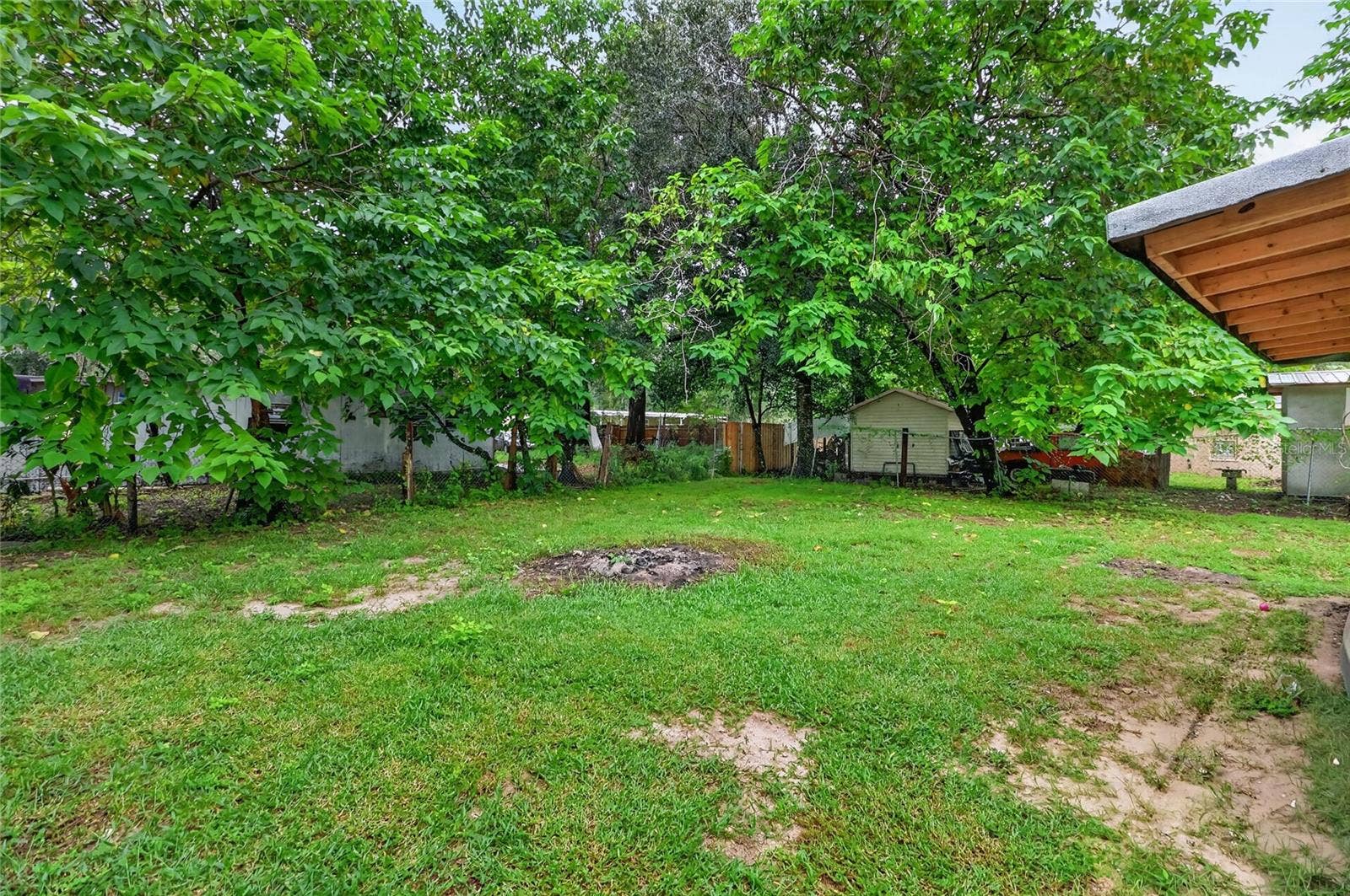 1529 COUNTY ROAD 547 N, Davenport, FL 33837 Yard between house and store