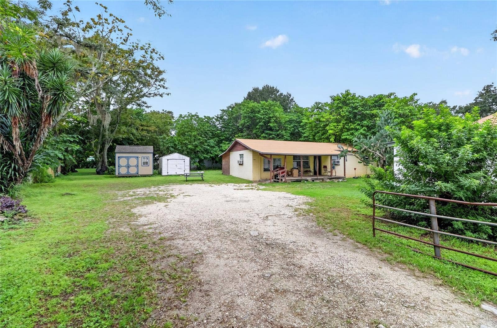 1529 COUNTY ROAD 547 N, Davenport, FL 33837 Road to house behind store