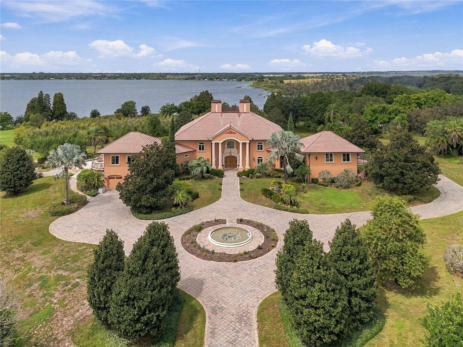501 ADAMS BARN ROAD, Auburndale, FL 33823 A rare opportunity to own one of Auburndales most impressive private estates. Set on 44.30 beautifully landscaped acres with more than 2,300 feet of water frontage, this remarkable property offers unmatched privacy, scale, and natural beauty.