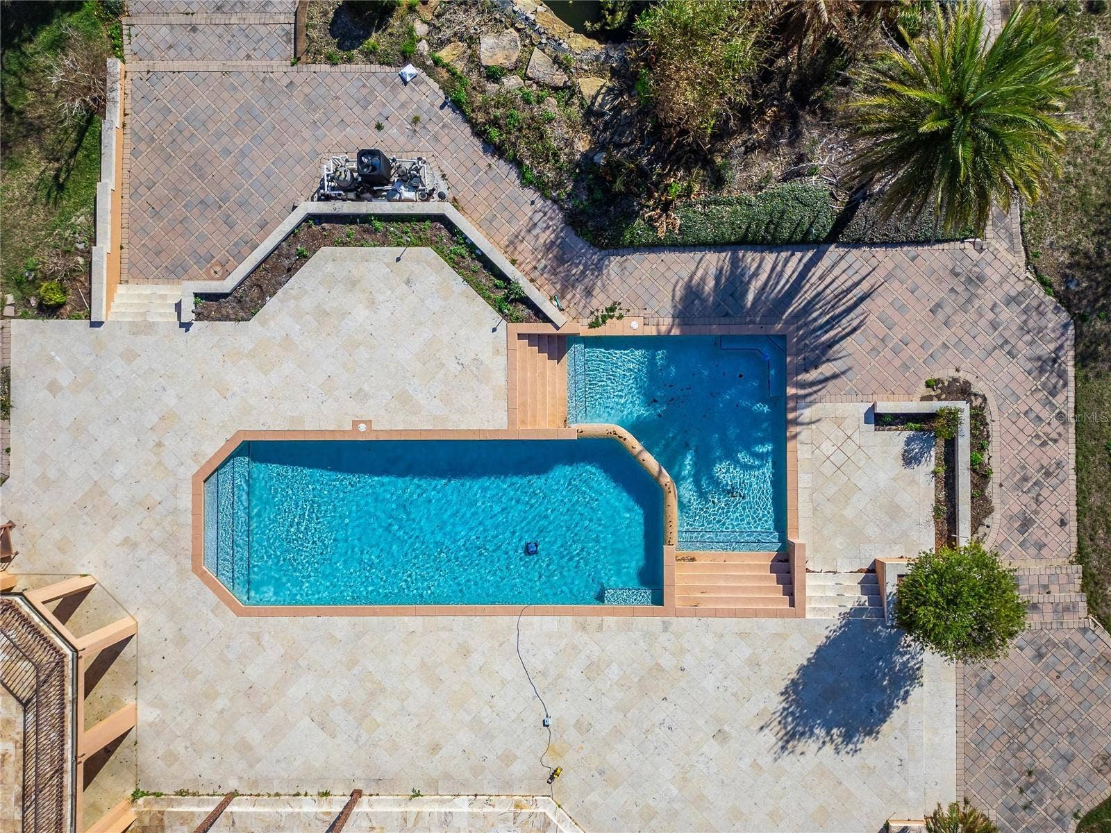501 ADAMS BARN ROAD, Auburndale, FL 33823 Outdoor amenities create a resort-style setting with a stunning pool featuring a waterfall edge, tennis courts, and a covered private boat dock. Additional outbuildings include a gardeners garage and pump house.