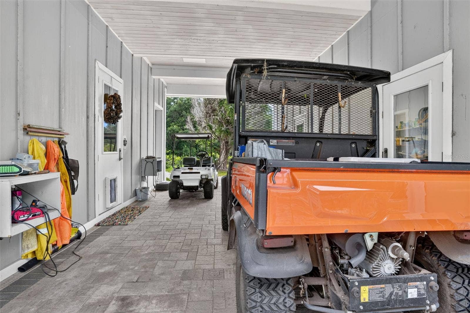 7950 BANNON FISH CAMP ROAD, Haines City, FL 33844 CARPORT BREEZEWAY OFF OF WORK SHOP BANNON ISLAND L4961212