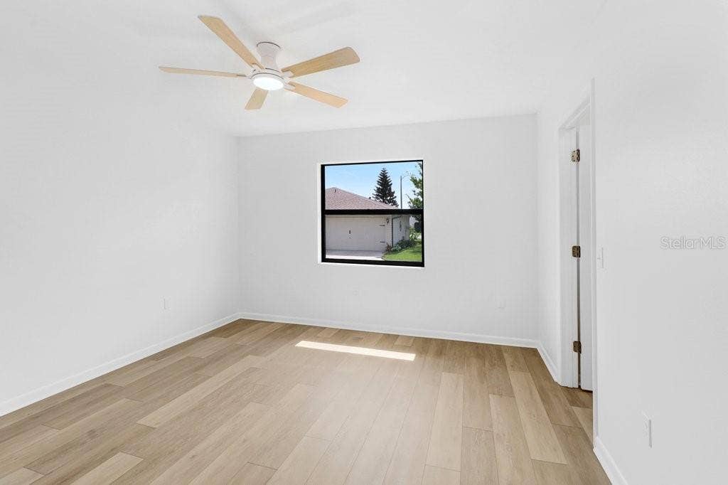 Second Bedroom with direct access to the hall bath. 6x9 walk in closet to the rear of photo.