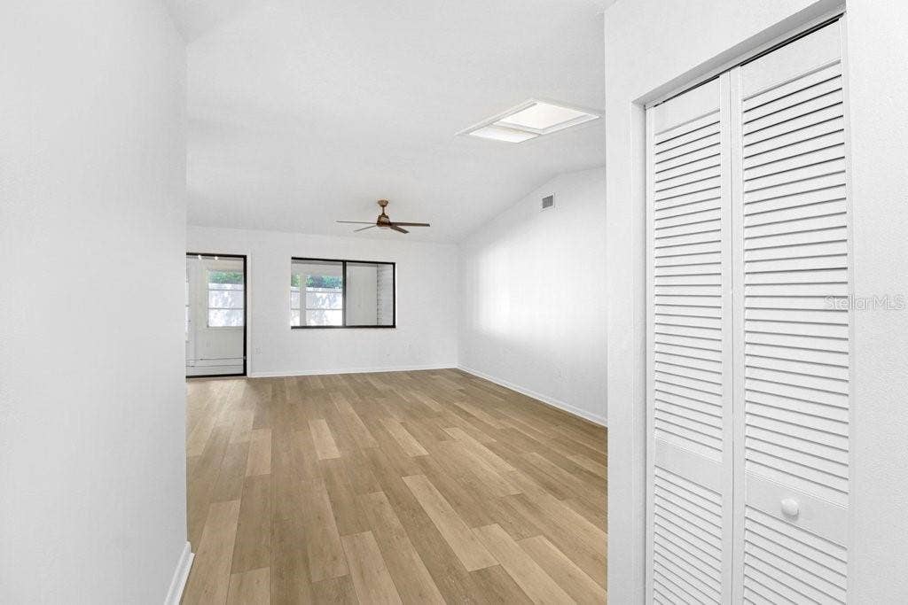 From the Front Door and Foyer step into the Living & Doing Room, entry closet and hallway to bedrooms to the right.