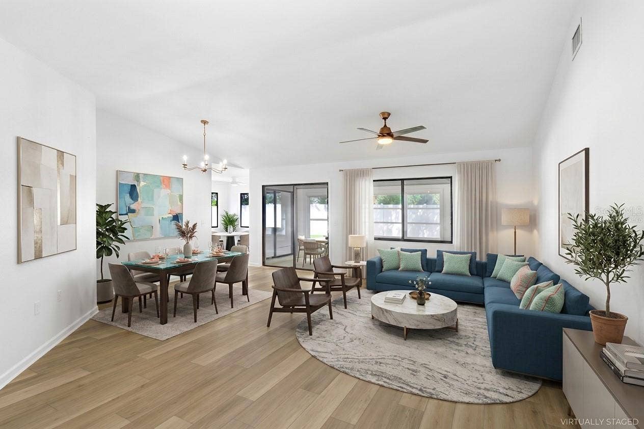 Virtually Staged: From Foyer to Living/Dining Room. Enclosed Patio and Outdoor terrace beyond the glass doors.  Dinette and Kitchen to the left and two bedrooms with connected bathrooms to the right.