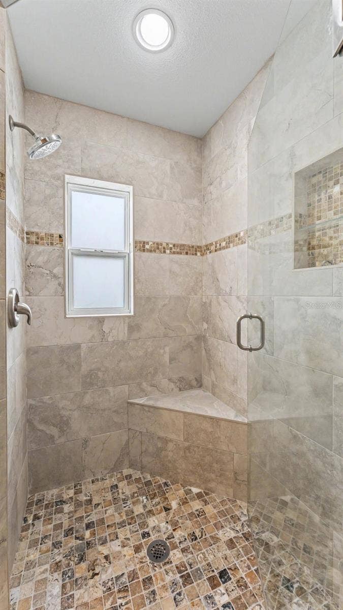 Upgraded remodeled shower in primary suite