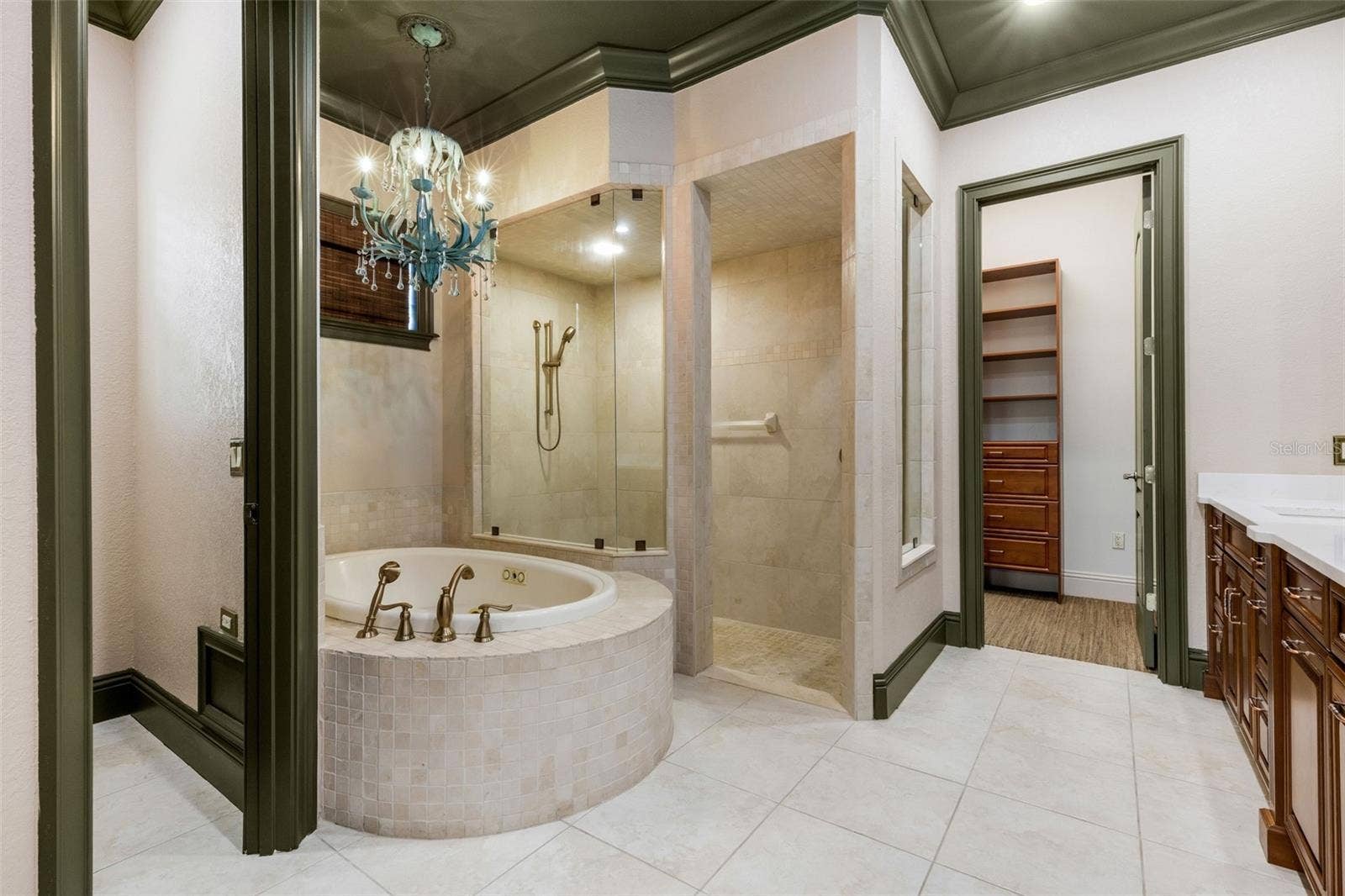 2734 BELLERIVE DRIVE, Lakeland, FL 33803 The deep jetted tub and fully tiled walk-in shower.