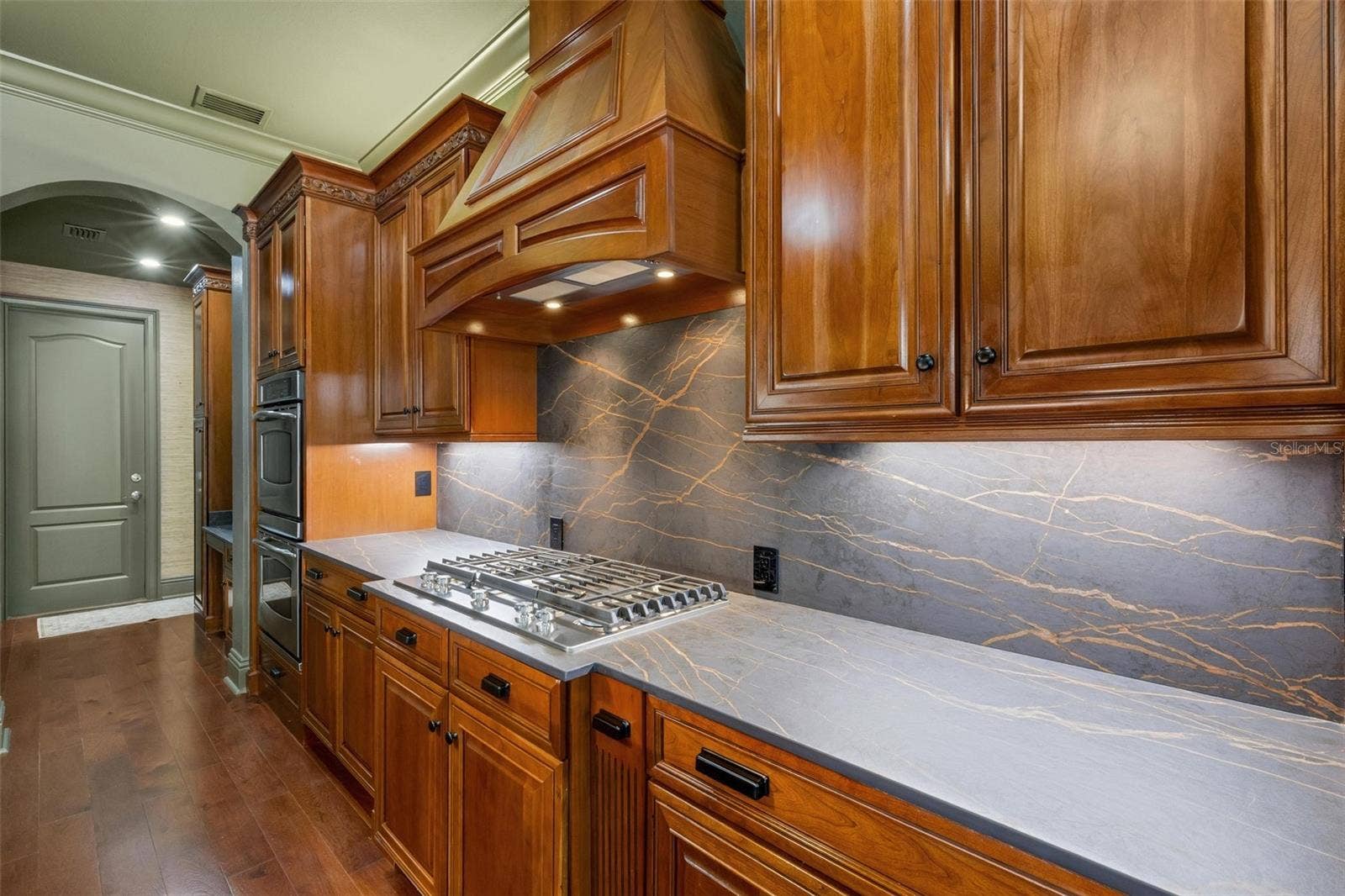 2734 BELLERIVE DRIVE, Lakeland, FL 33803 The six-burner gas cooktop, built-in ovens, built-in GE Monogram refrigerator are just icing on the cake.