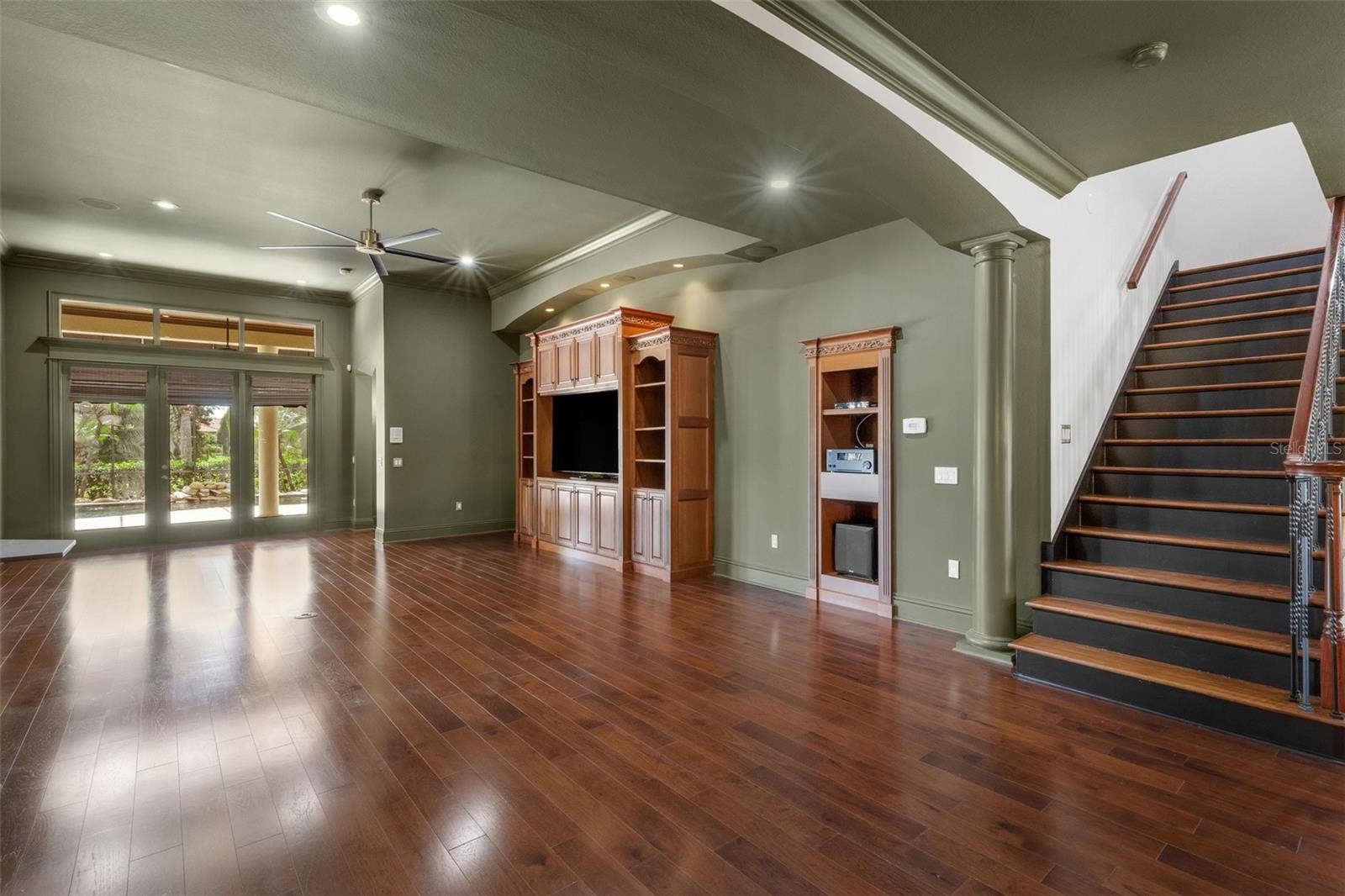 2734 BELLERIVE DRIVE, Lakeland, FL 33803 The massive greatroom features a built-in entertainment center and space for equipment elements that support the whole house sound system.