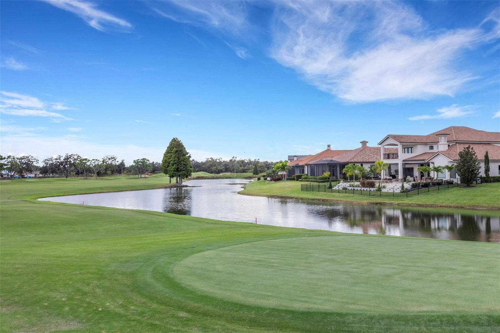 2734 BELLERIVE DRIVE, Lakeland, FL 33803 and the lush fairways and greens will challenge your skills.