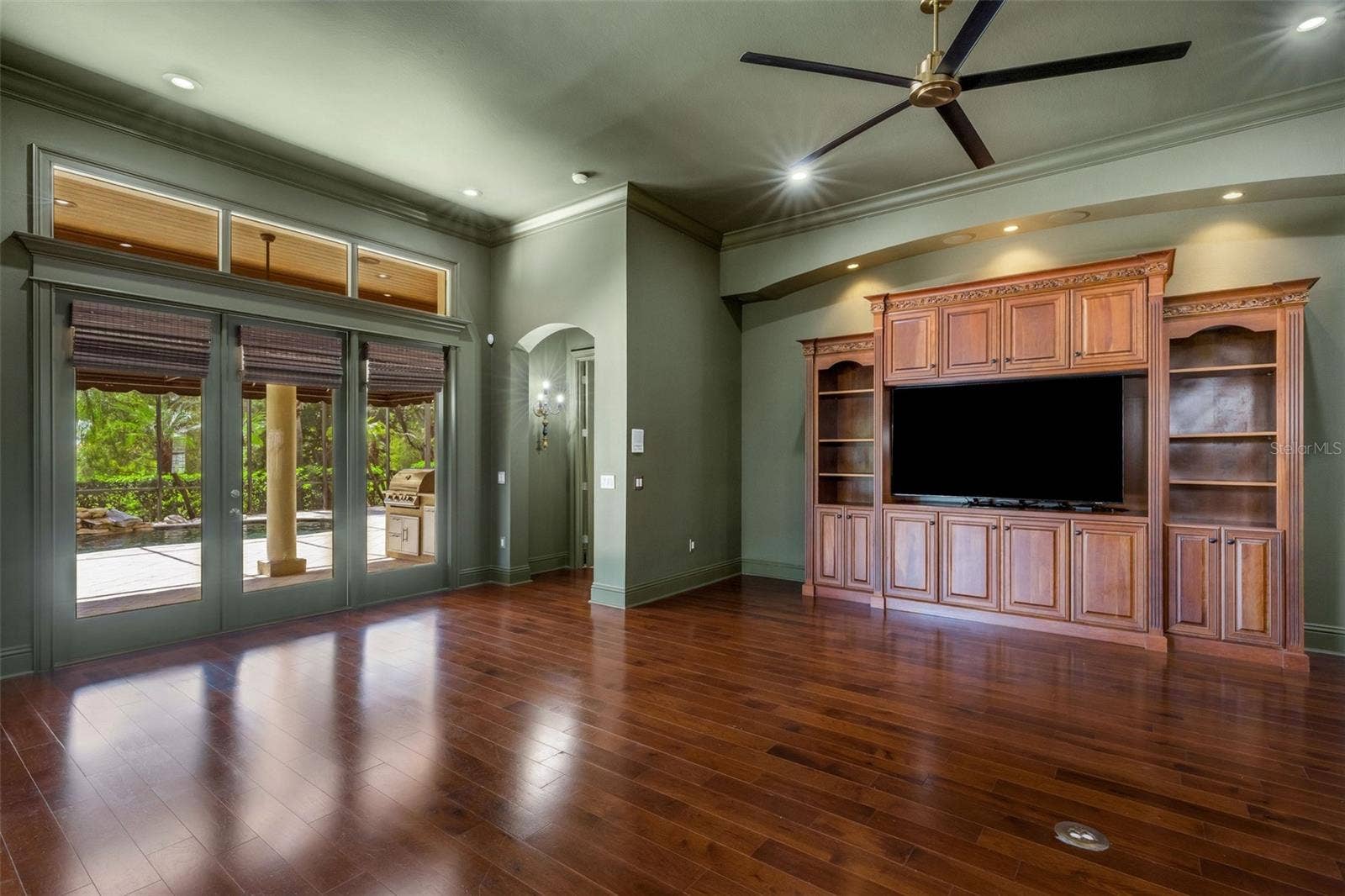 2734 BELLERIVE DRIVE, Lakeland, FL 33803 This space features a full bank of glass doors leading to the lanai and pool area.
