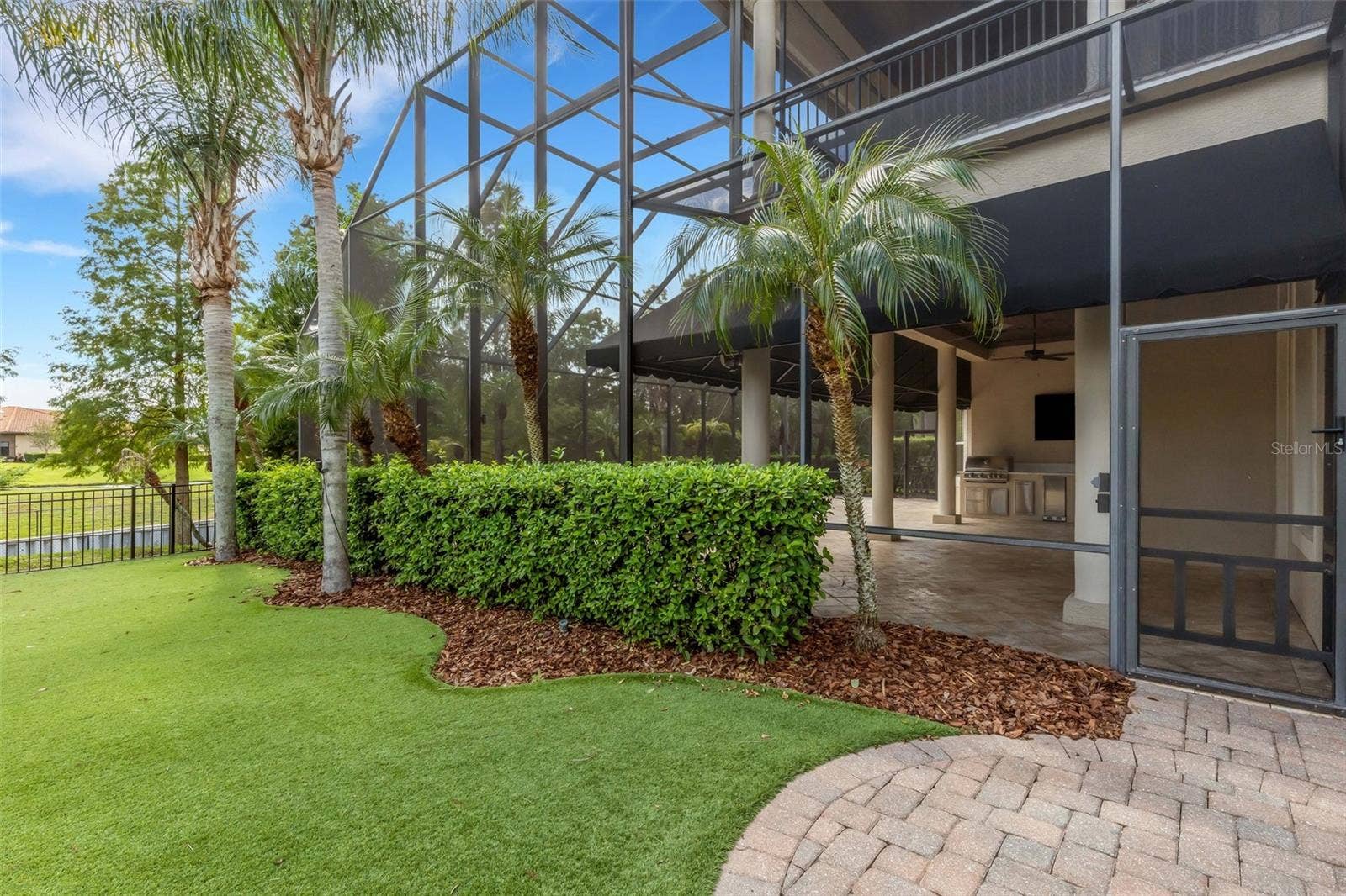 2734 BELLERIVE DRIVE, Lakeland, FL 33803 Step outside the enclosure to the fenced in play or dog area . . .