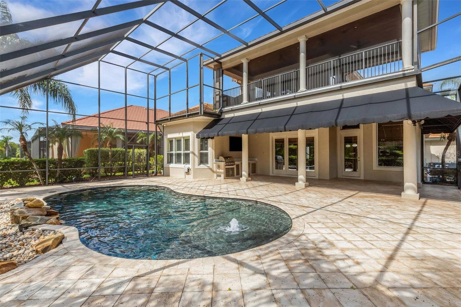 2734 BELLERIVE DRIVE, Lakeland, FL 33803 Travertine decking all around.