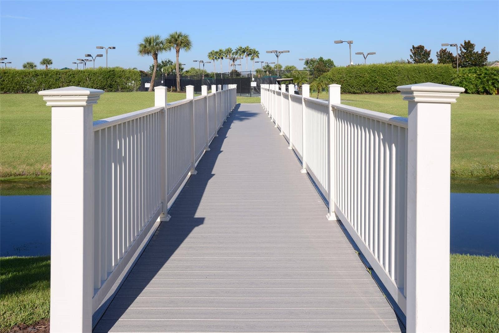 2734 BELLERIVE DRIVE, Lakeland, FL 33803 Across the footbridge you'll find the lighted tennis and pickleball courts . . .