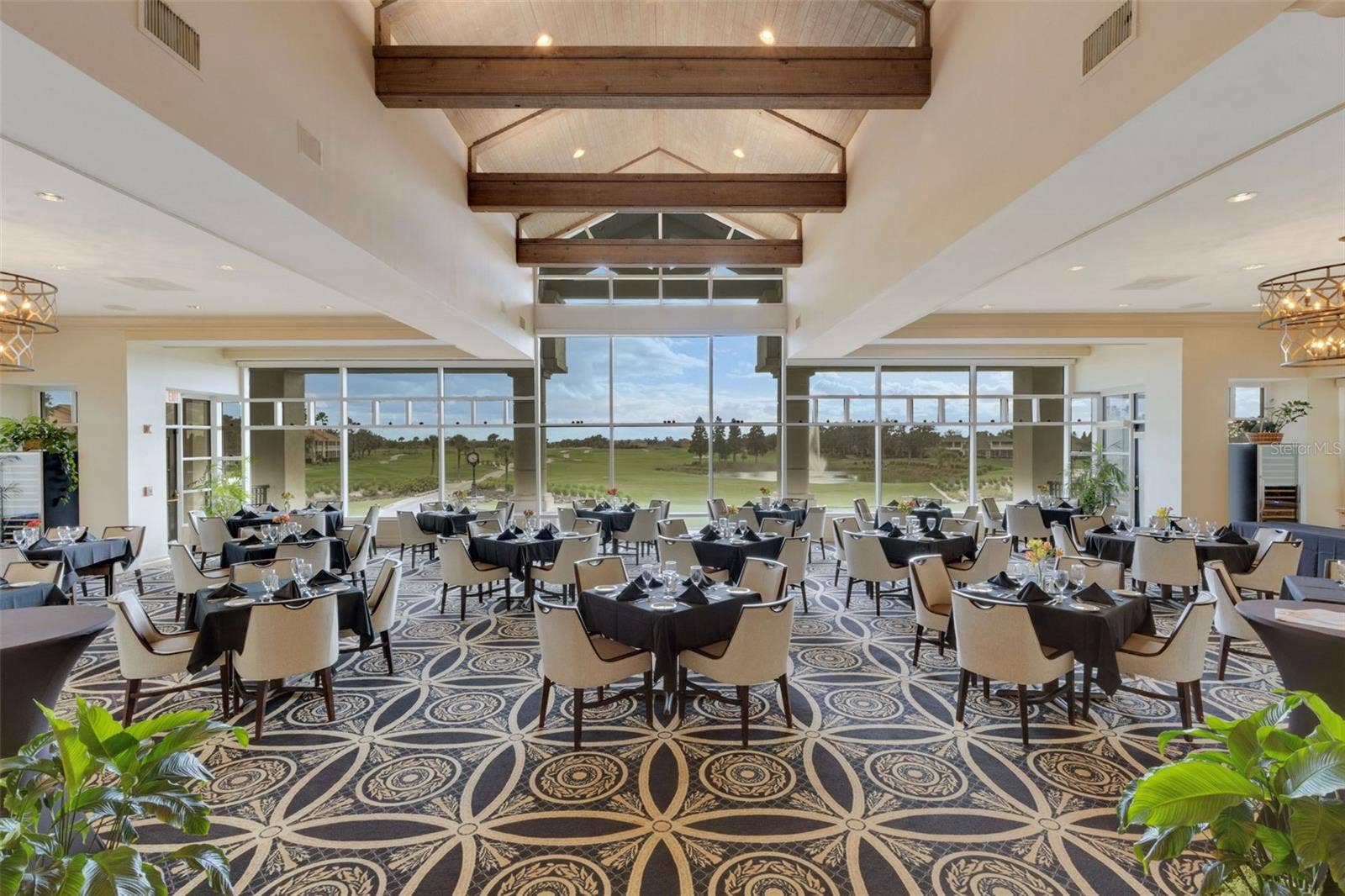 2734 BELLERIVE DRIVE, Lakeland, FL 33803 The elegant main dining room has stunning panoramic views of the golf course beyond.