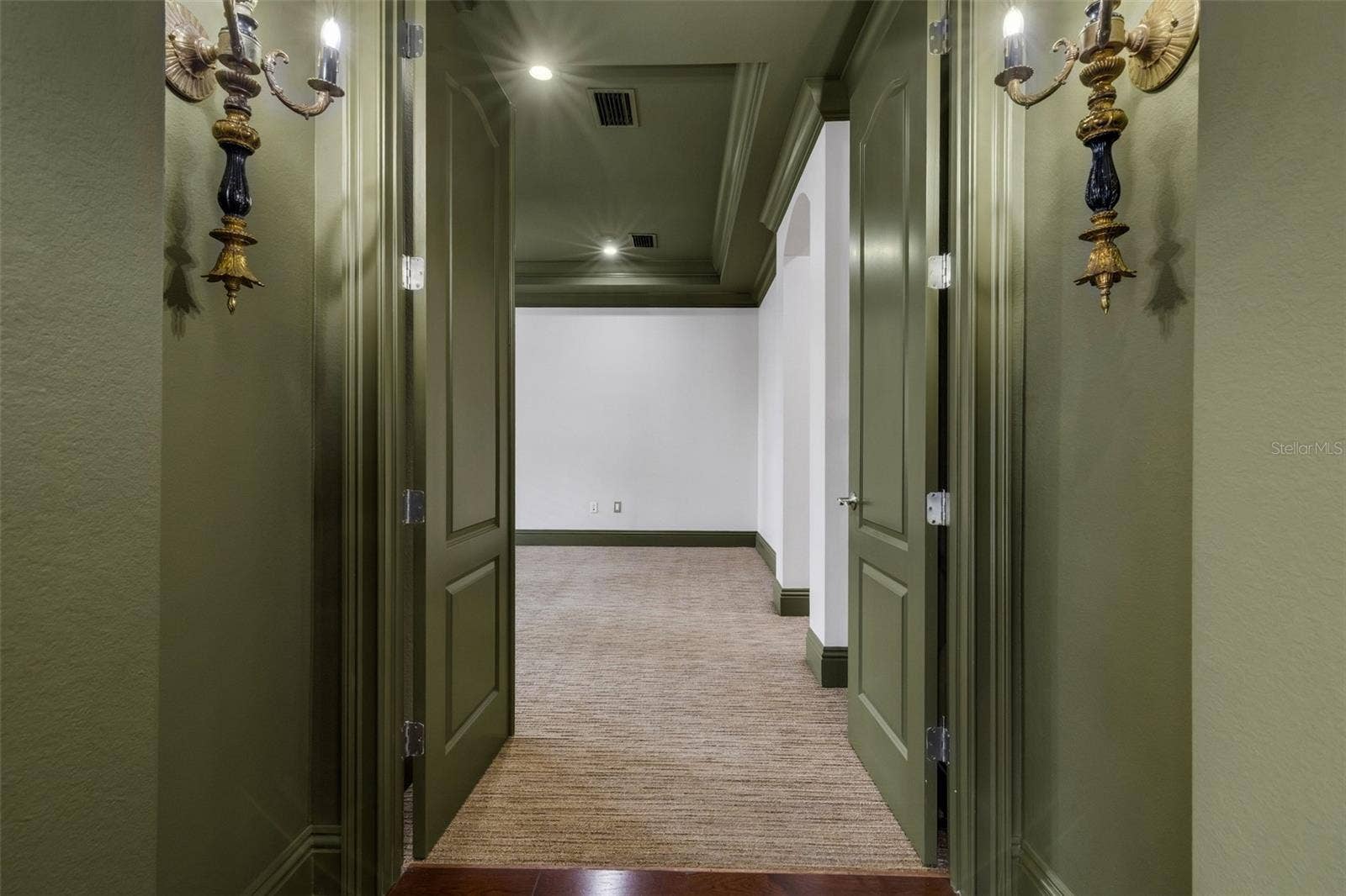 2734 BELLERIVE DRIVE, Lakeland, FL 33803 The primary suite is on the first floor and secluded away through double doors.