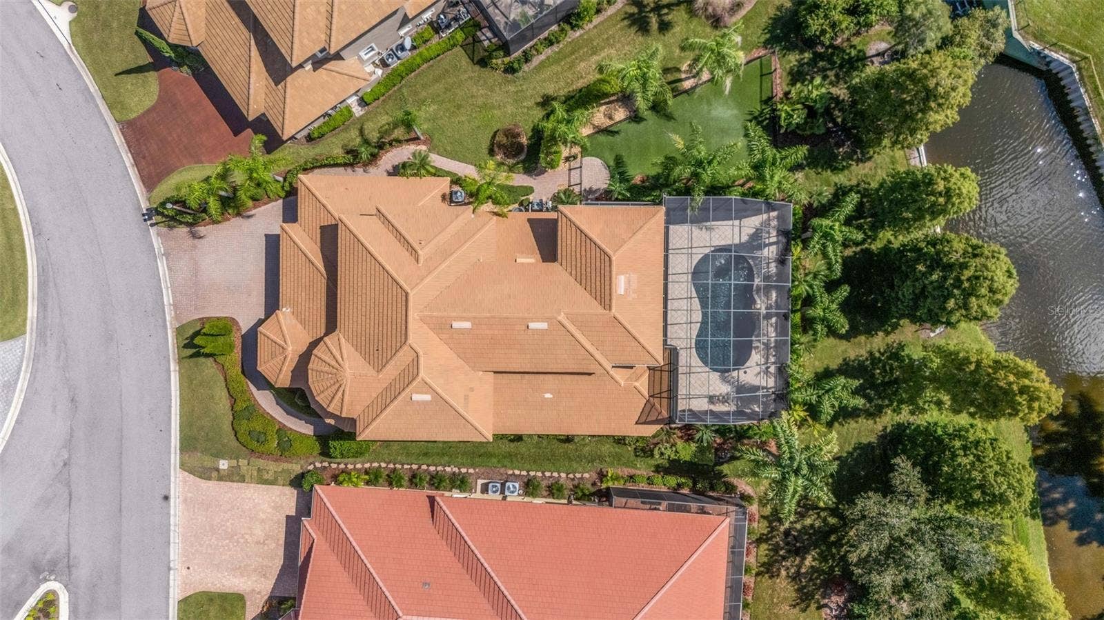 2734 BELLERIVE DRIVE, Lakeland, FL 33803 And this beauty is situated at the far end of the street with views of the water and golf course beyond.