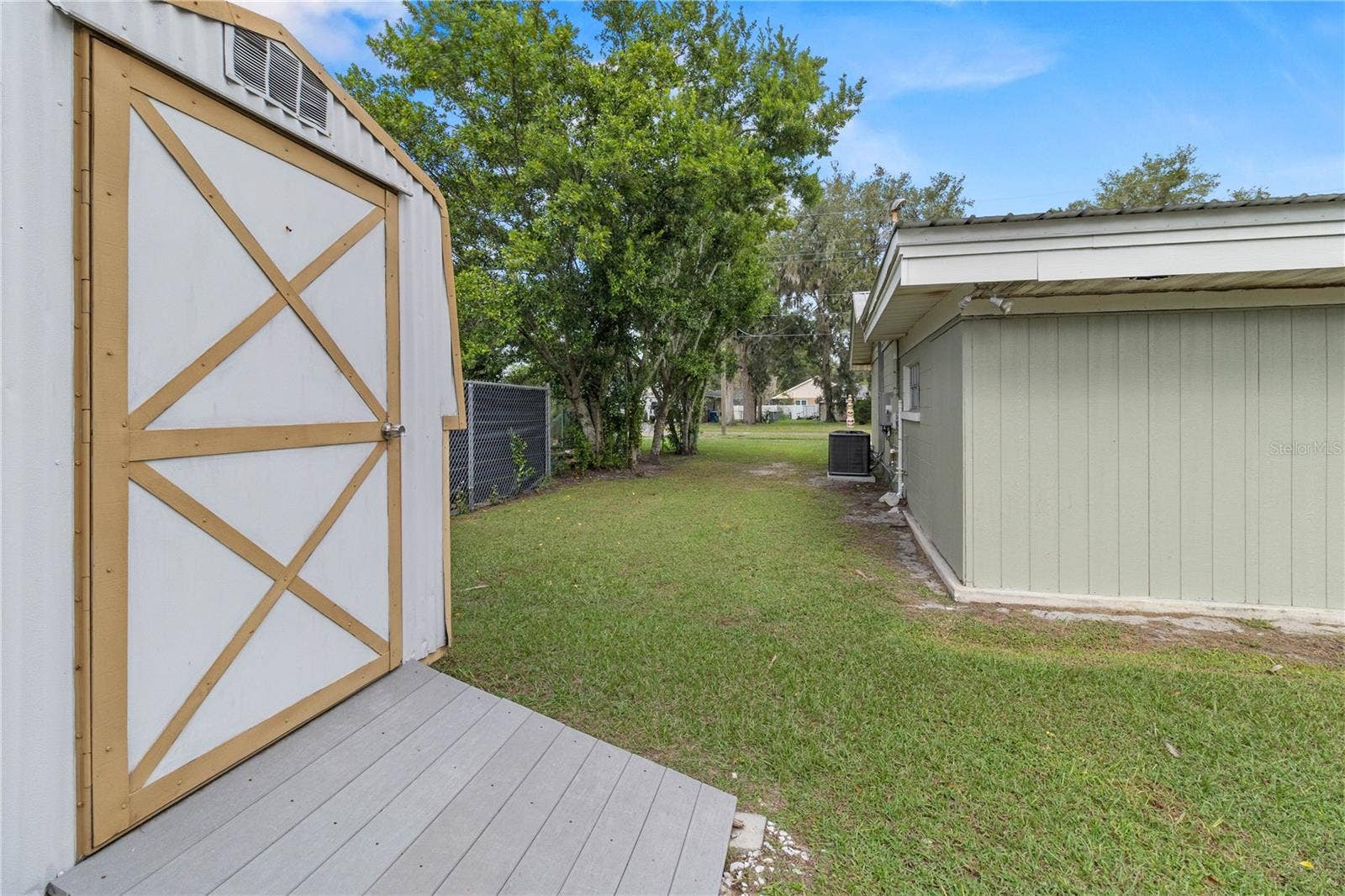 222 6TH STREET NE, Fort Meade, FL 33841 Side yard and view of shed
