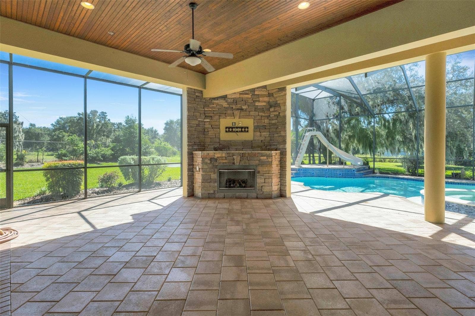 6562 EAGLE VIEW LOOP, Lakeland, FL 33813 And, with the cooler weather approaching you can gather around the gas fireplace and have your own sports watch party simply with the addition of a TV above the fireplace.