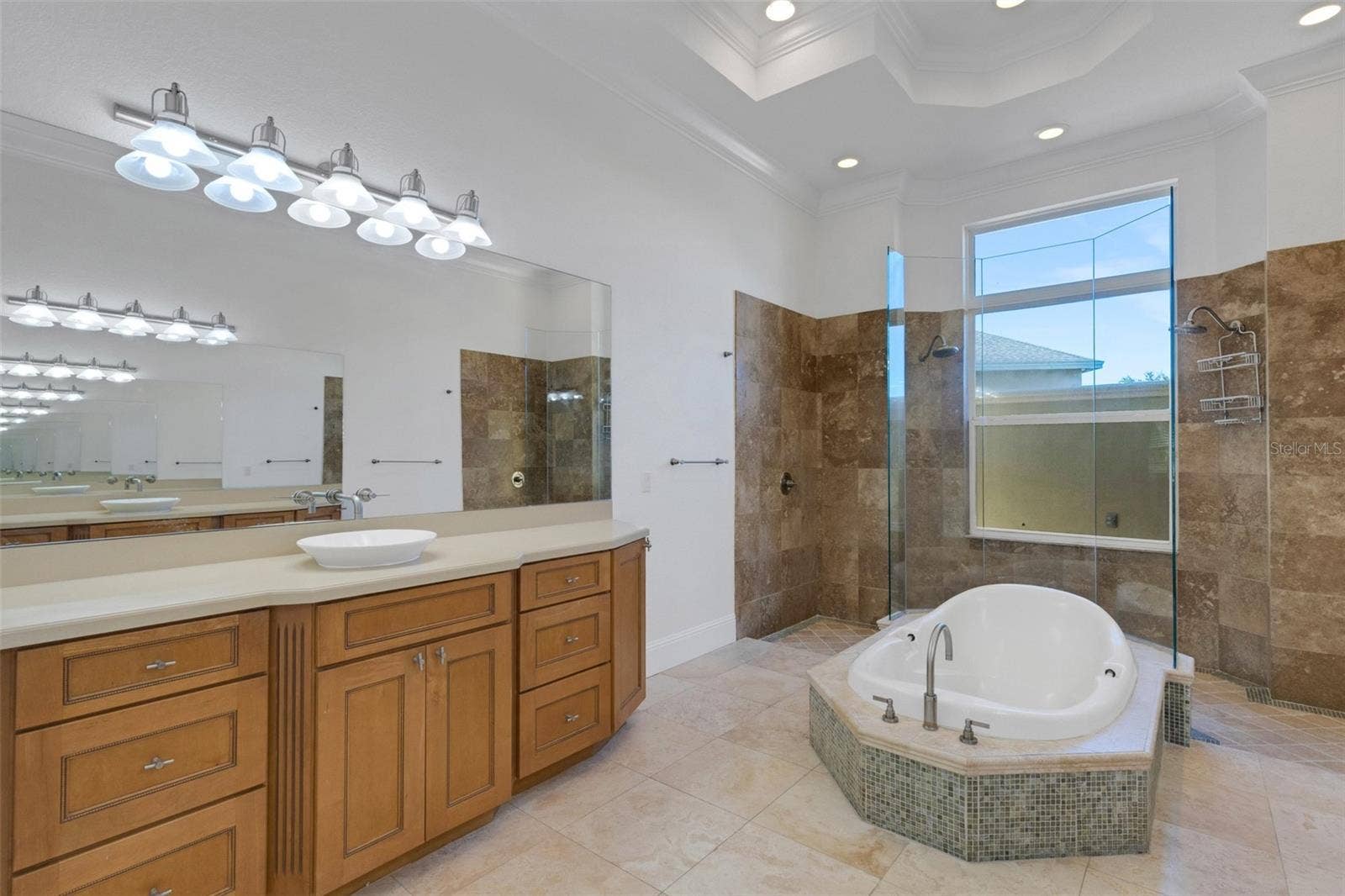 6562 EAGLE VIEW LOOP, Lakeland, FL 33813 The ensuite bathroom has dual long vanities with tons of storage.