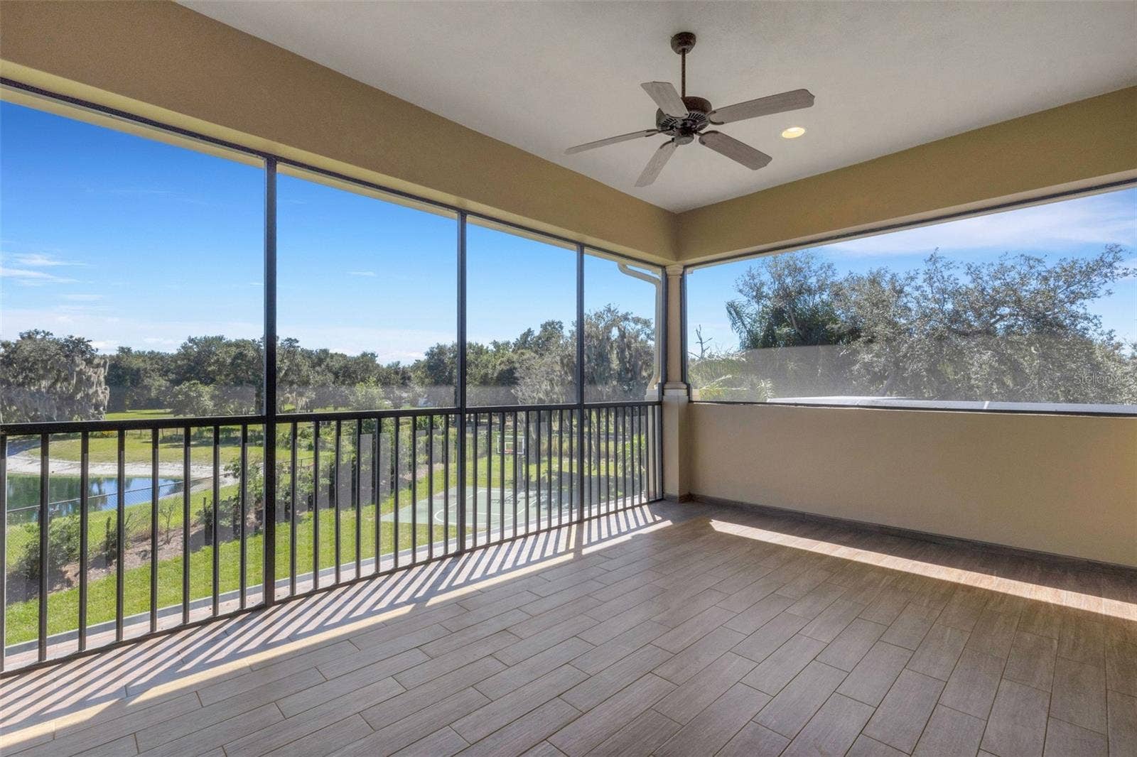 6562 EAGLE VIEW LOOP, Lakeland, FL 33813 The screen enclosed balcony affords panoramic views that extend well beyond the backyard.