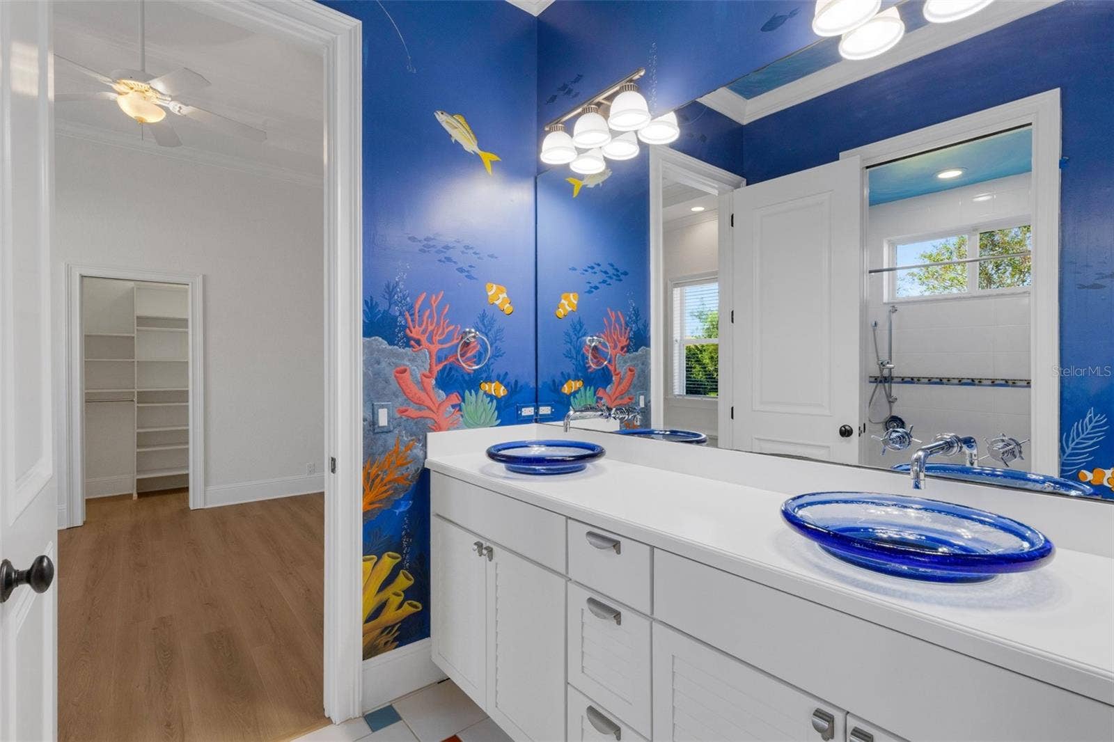 6562 EAGLE VIEW LOOP, Lakeland, FL 33813 and the glass countertop mounted sinks will make brushing their teeth a treat!