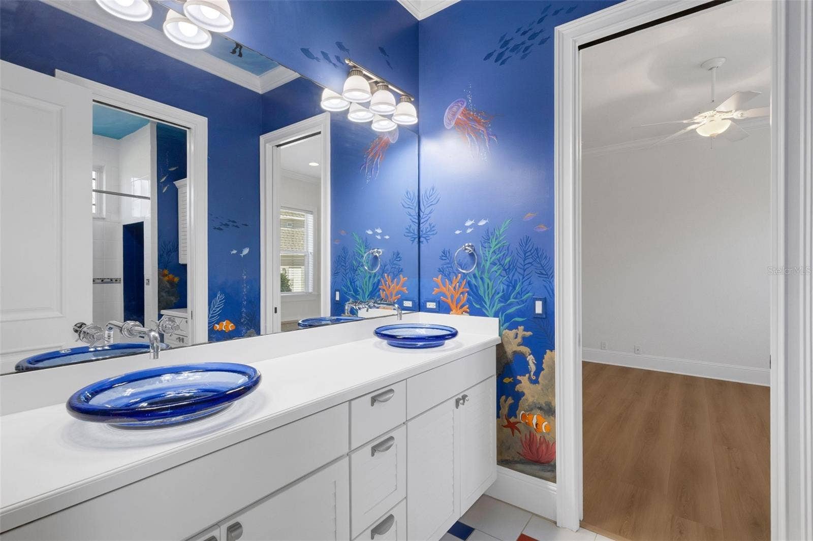 6562 EAGLE VIEW LOOP, Lakeland, FL 33813 Bathroom# 2 has a custom painted mural that will make children WANT to take a bath.