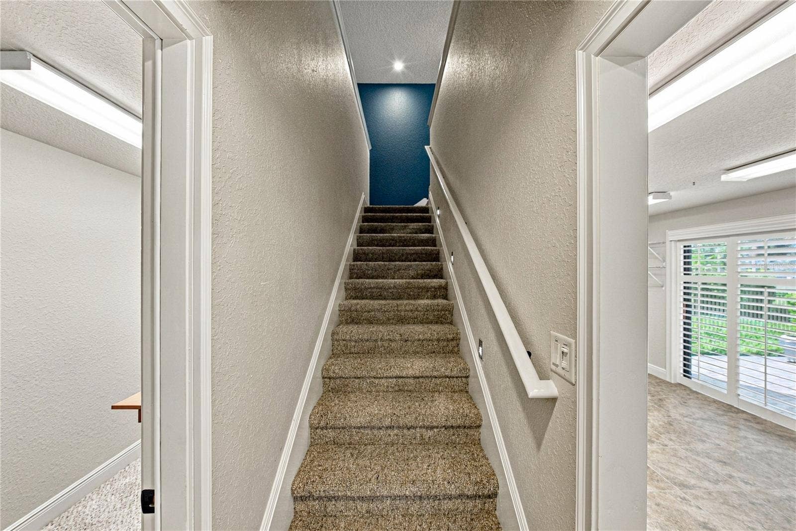 Stairs to bonus room and spacious attic for easy storage