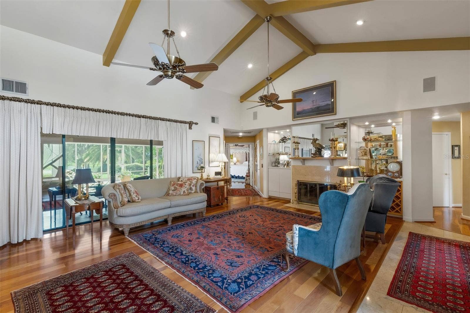 3507 BARLEY LANE, Lakeland, FL 33803 The formal living room greets all who enter with stunning views through the glass sliders . . .