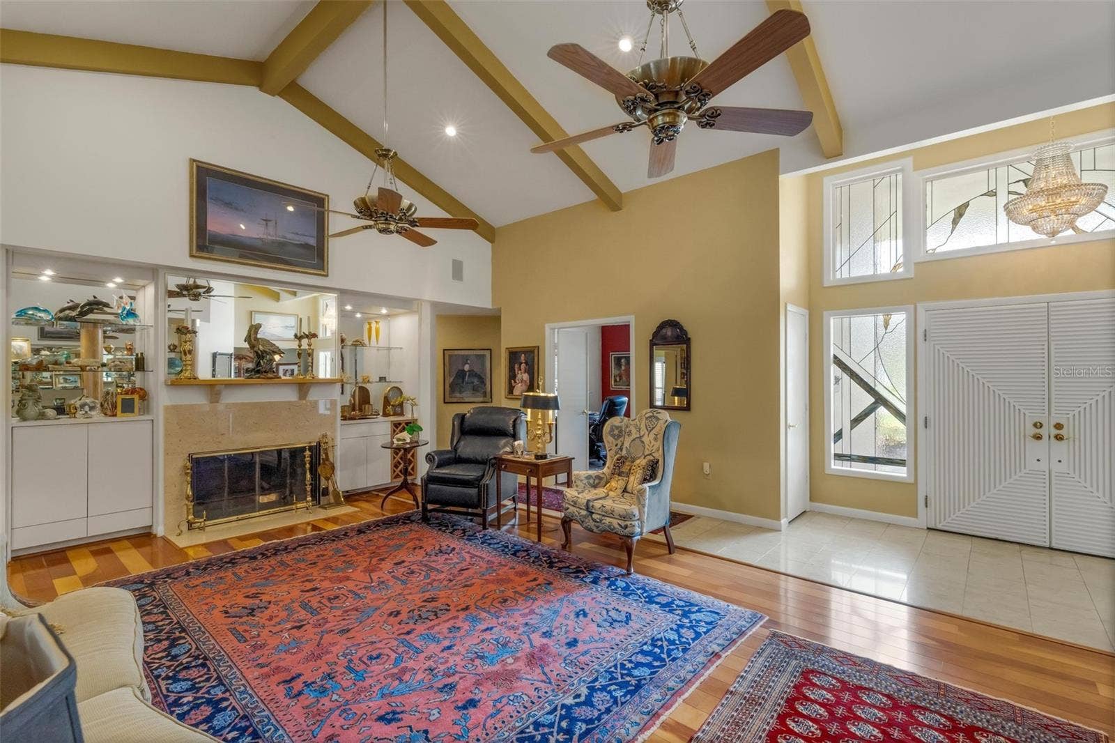 3507 BARLEY LANE, Lakeland, FL 33803 beamed ceilings, fireplace and custom built-ins at both ends of the room.