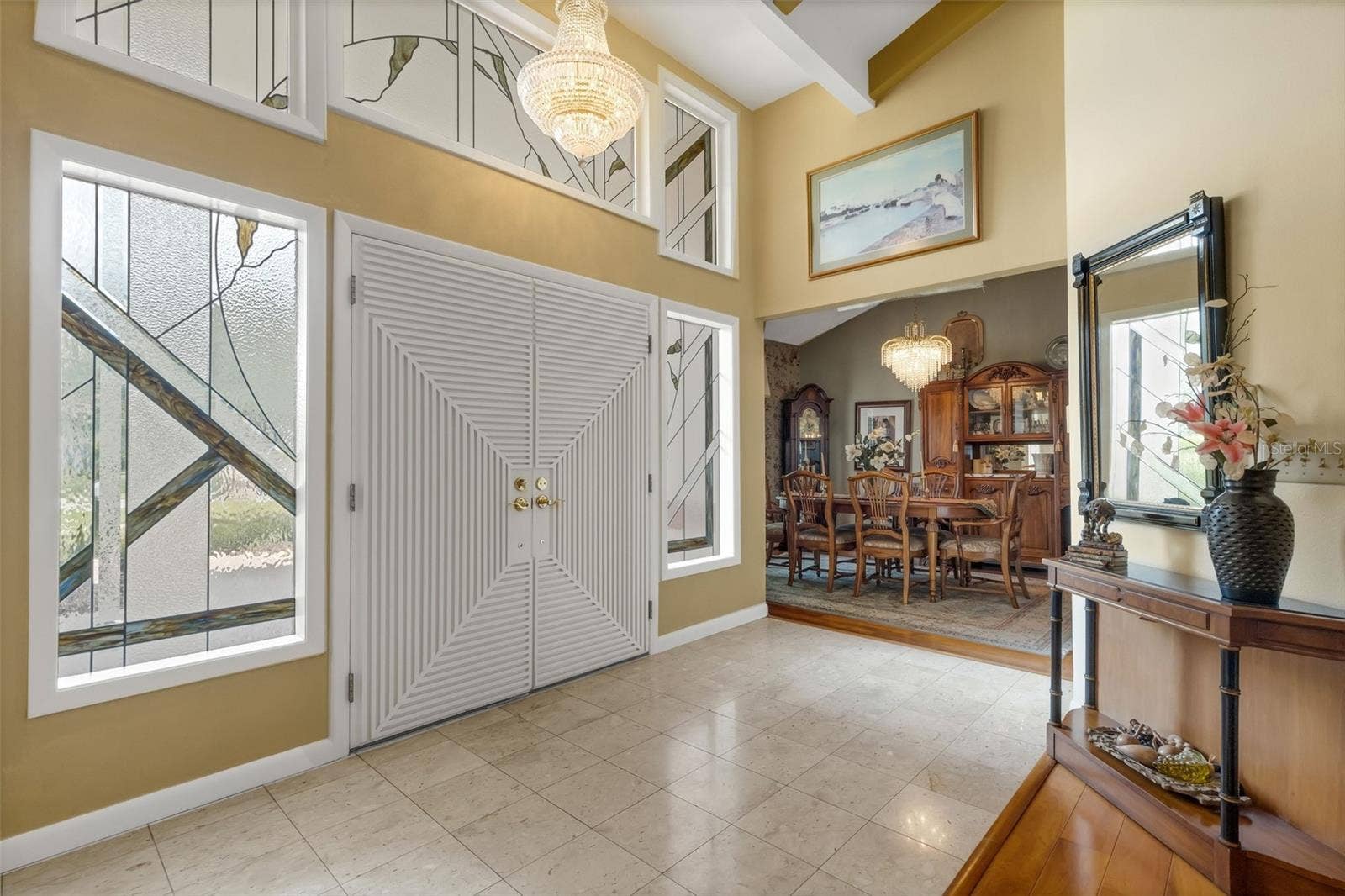 3507 BARLEY LANE, Lakeland, FL 33803 The wide double door foyer boasts easy care marble flooring and custom transom and sidelight window inserts.