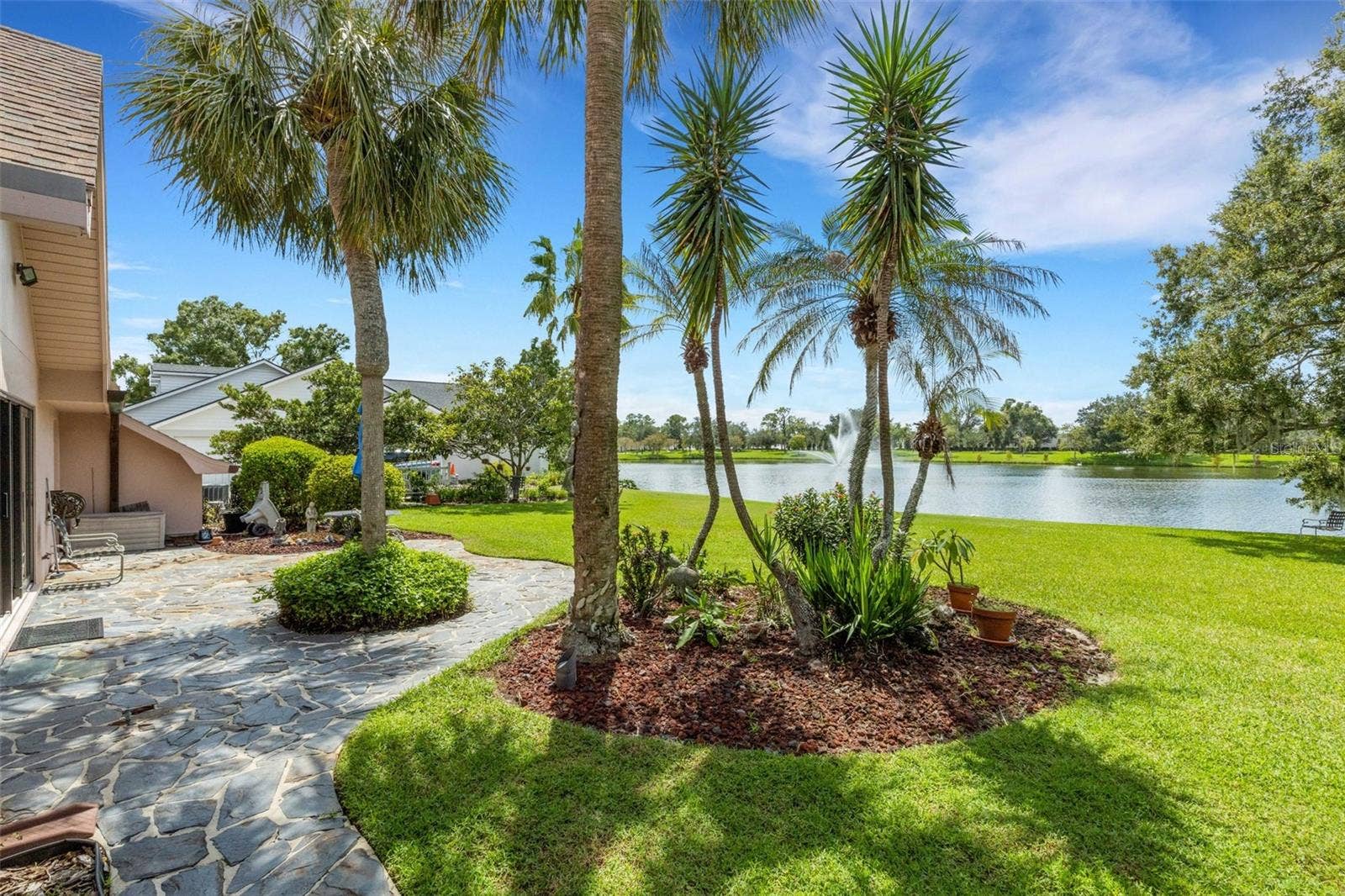 3507 BARLEY LANE, Lakeland, FL 33803 Stepping outside you'll find the flagstone walkway become and open patio.