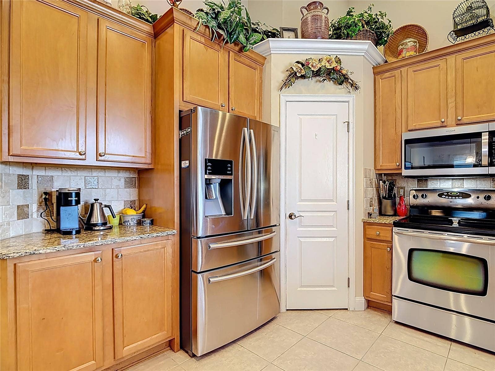 Stainless appliances and a pantry