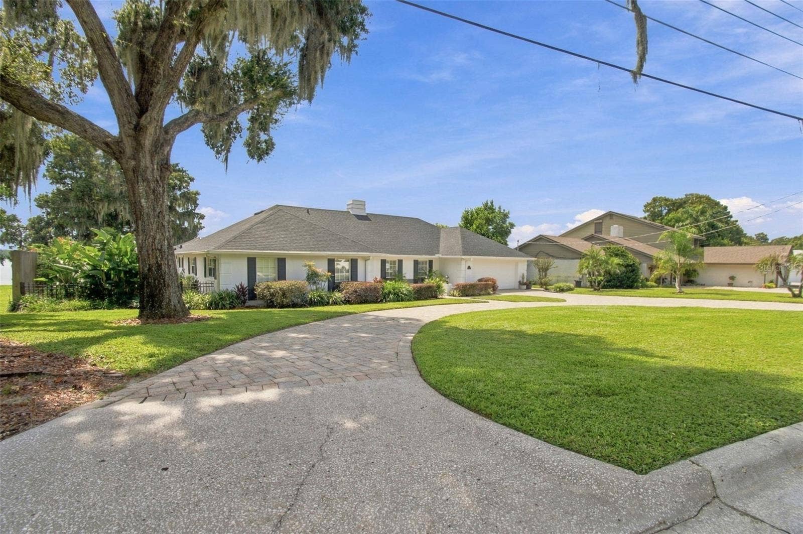1921 MANOR CIRCLE SE, Winter Haven, FL 33880 Front exterior - circle drive