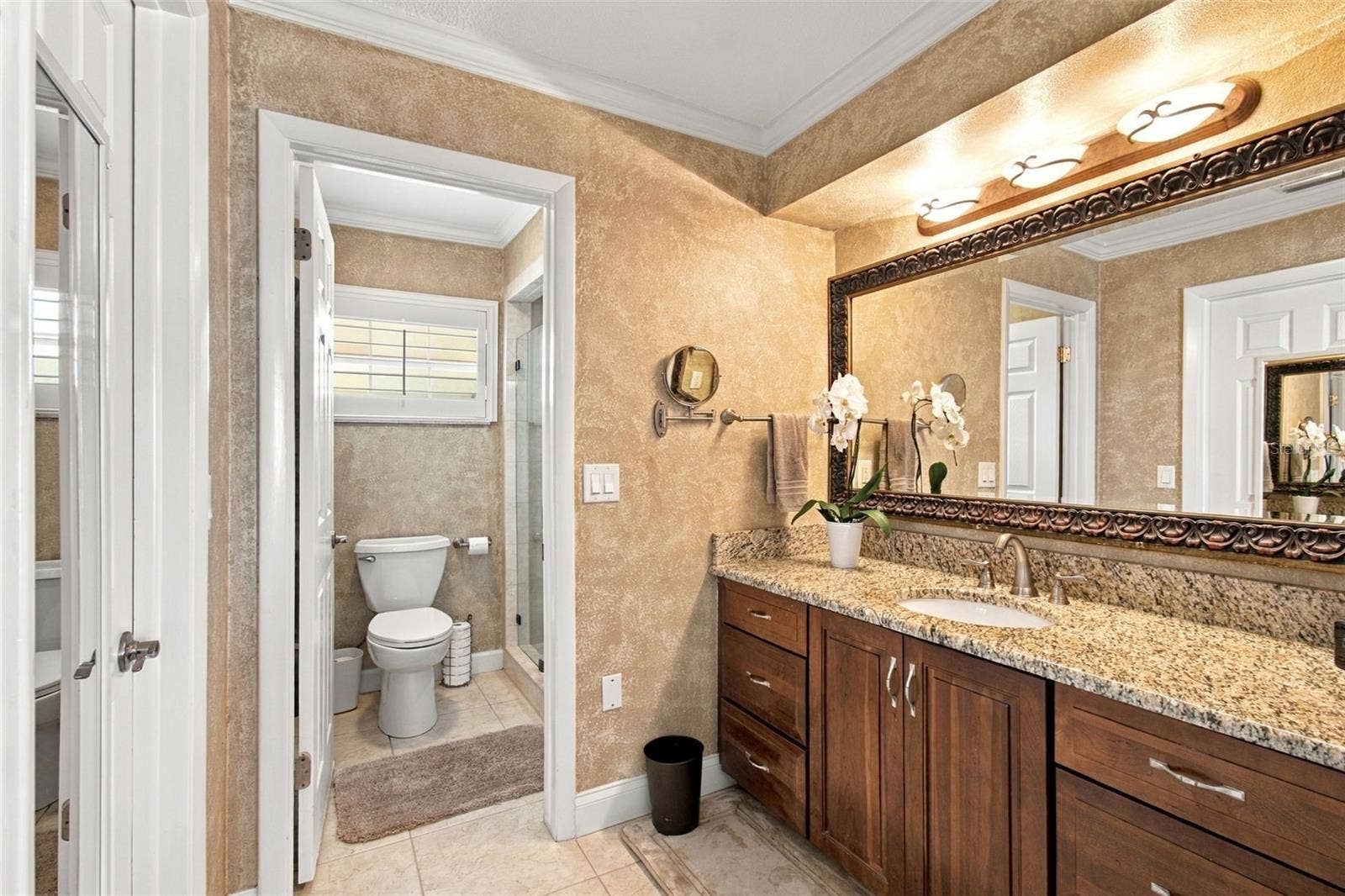 1921 MANOR CIRCLE SE, Winter Haven, FL 33880 Primary bathroom - Granite countertops, double sink vanity, large custom closet
