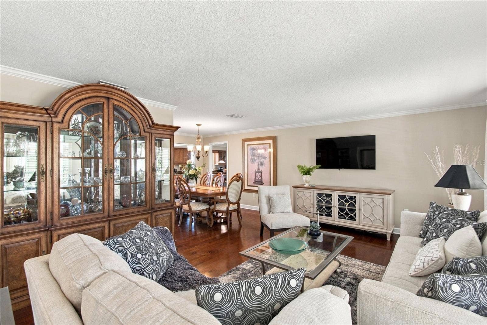 1921 MANOR CIRCLE SE, Winter Haven, FL 33880 Formal living room - Hardwood flooring