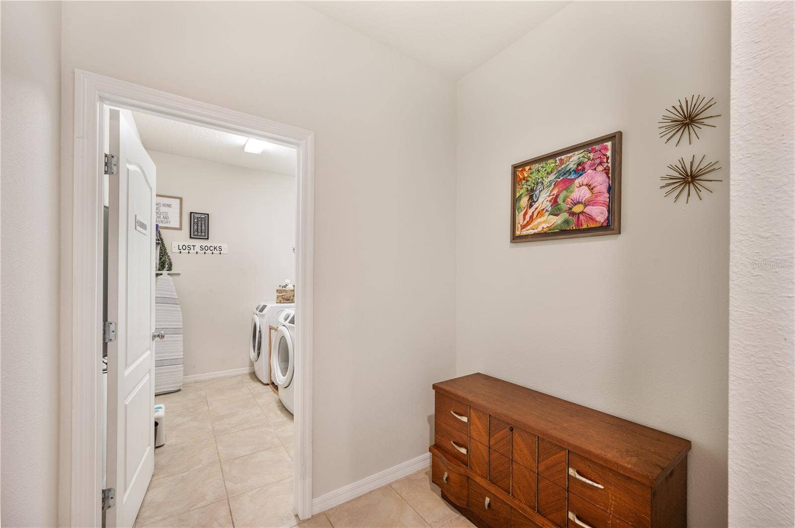 8751 RINDGE ROAD, Polk City, FL 33868 Looking into Laundry Room