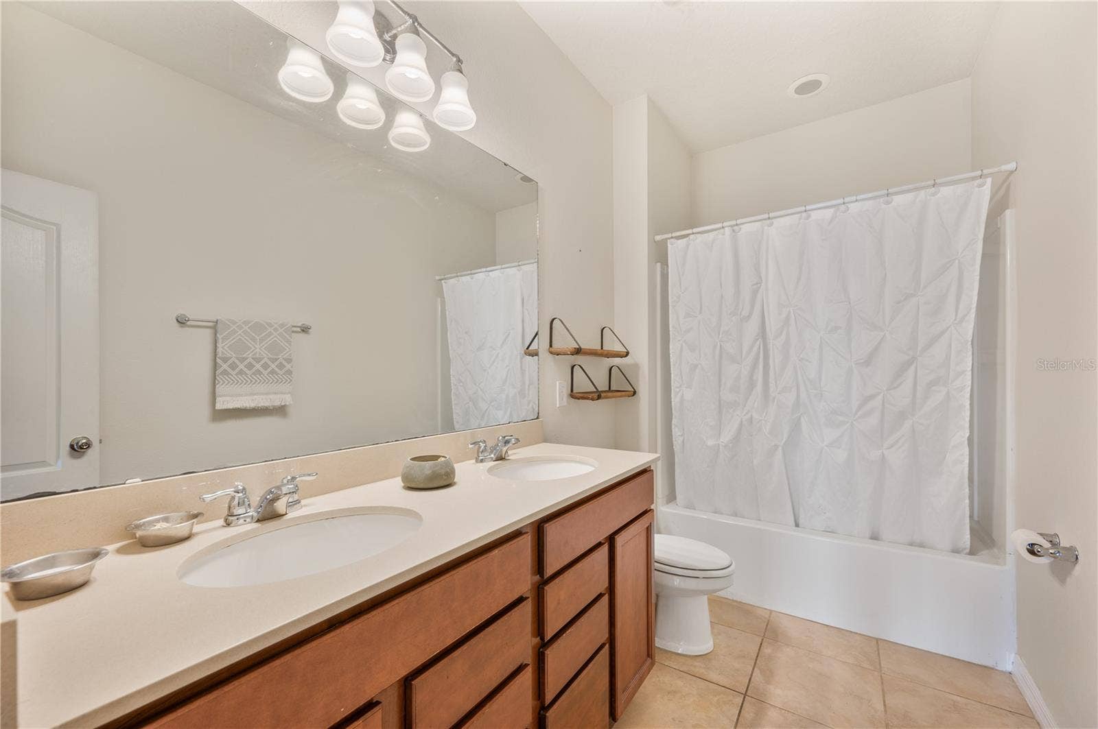 8751 RINDGE ROAD, Polk City, FL 33868 Hallway Bathroom / Dual Sinks