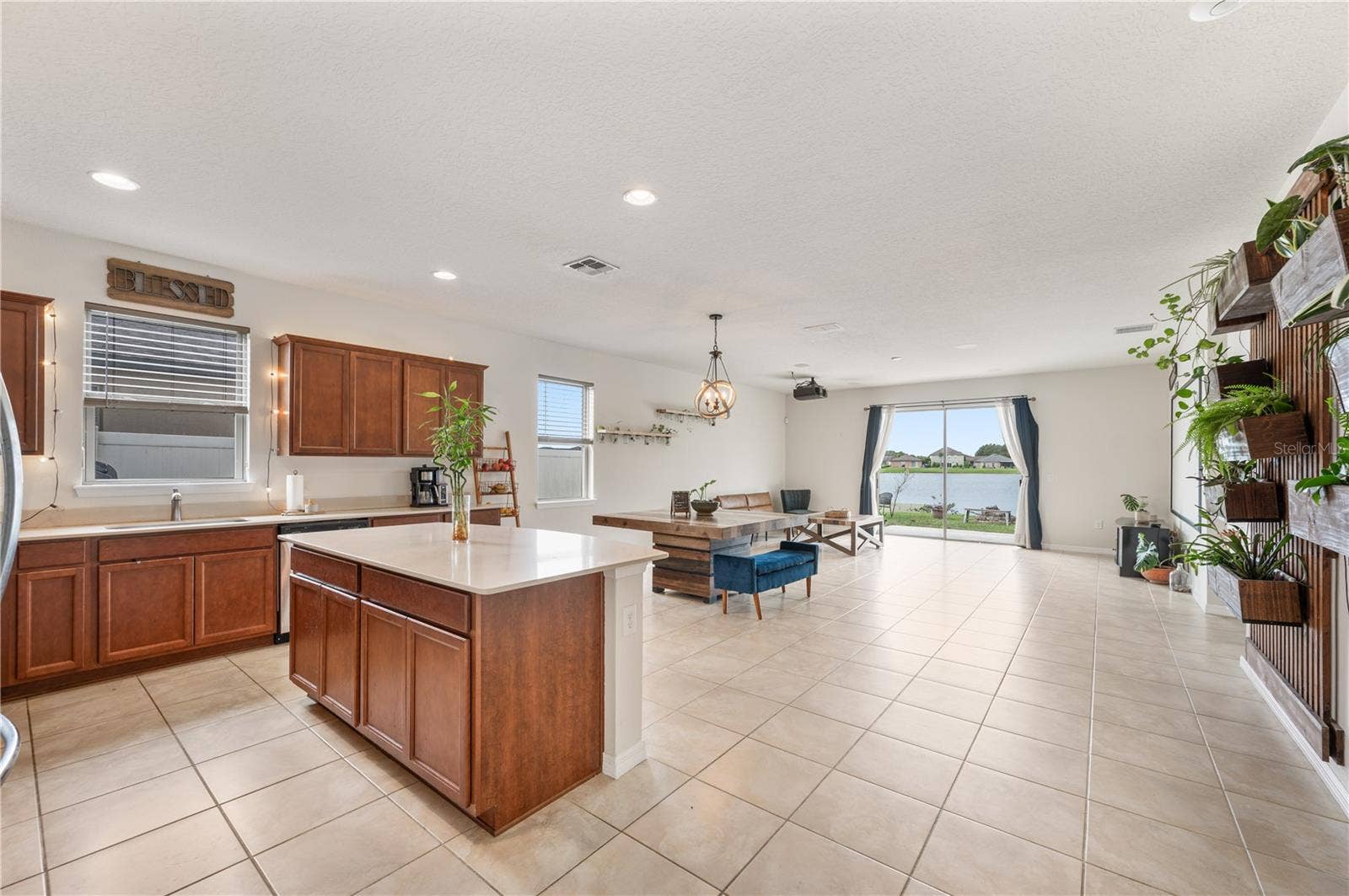 8751 RINDGE ROAD, Polk City, FL 33868 Open Floor Plan / Kitchen / Dining Room / Living Room