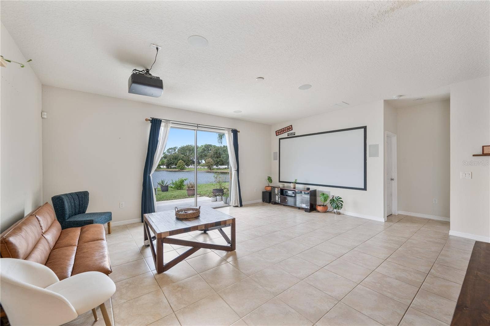 8751 RINDGE ROAD, Polk City, FL 33868 Open Floor Plan / Kitchen / Dining Room / Living Room