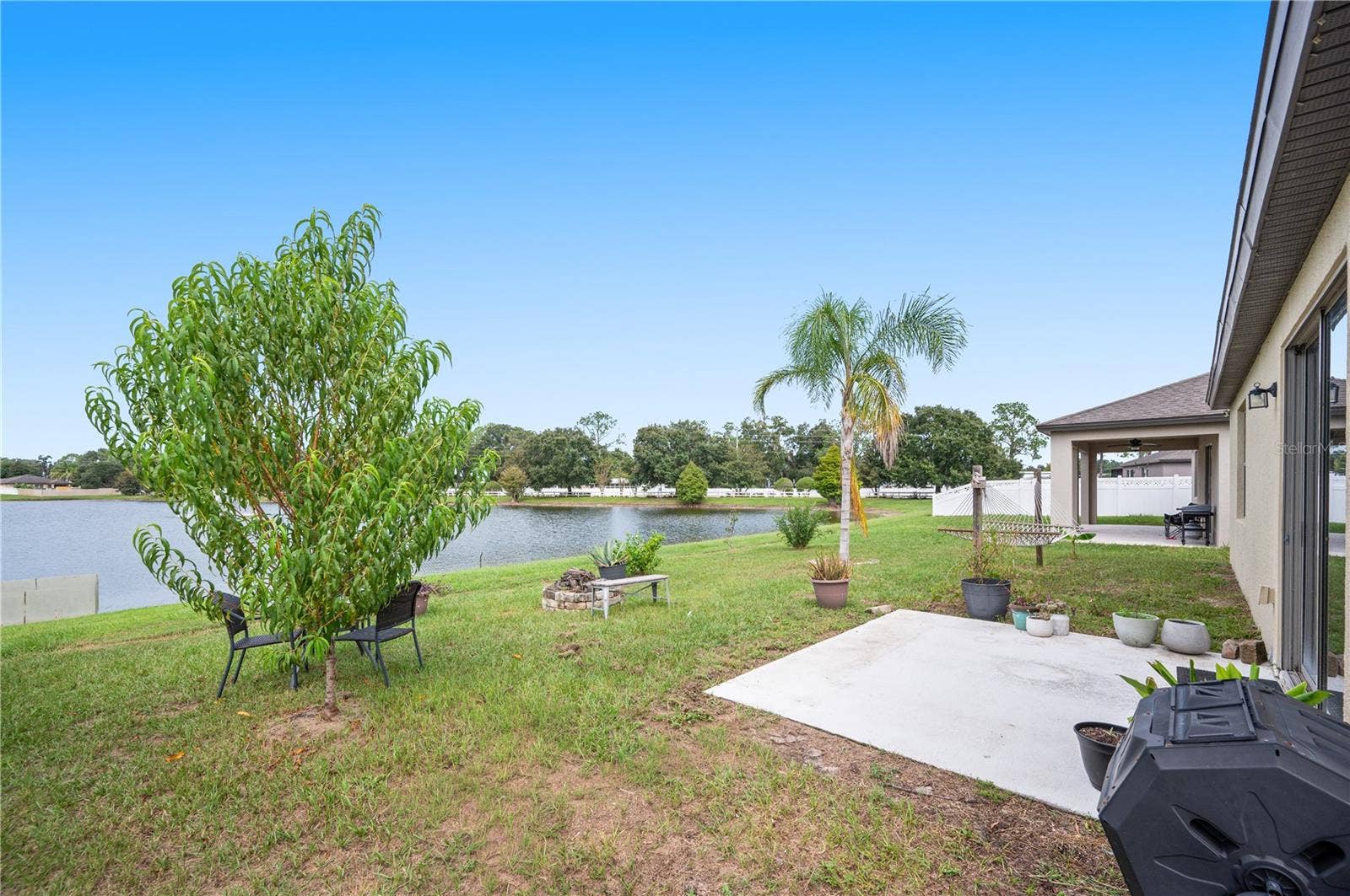 8751 RINDGE ROAD, Polk City, FL 33868 Backyard Pond View