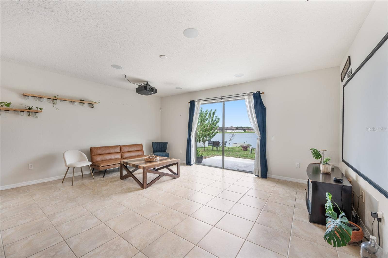 8751 RINDGE ROAD, Polk City, FL 33868 Living Room with Pond Views