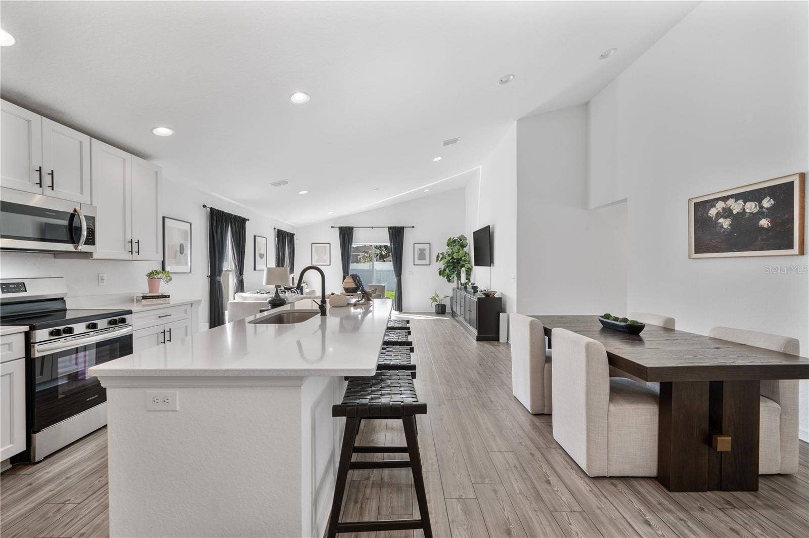 1279 PINTAIL PLACE, Lakeland, FL 33813 The kitchen & dining room are light & bright. Luxury vinyl plank flooring flow seamlessly throughout this entire home.