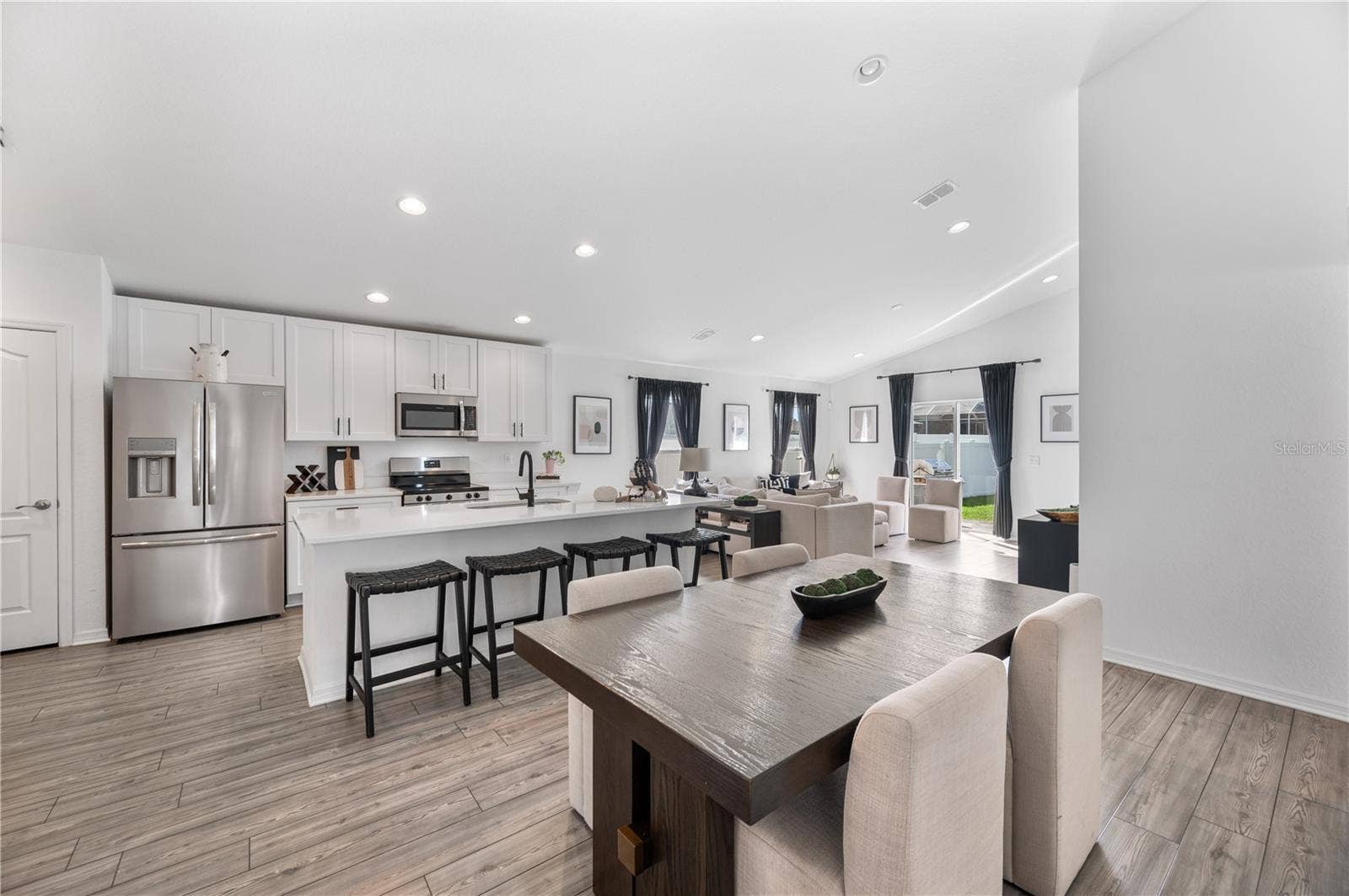 1279 PINTAIL PLACE, Lakeland, FL 33813 An expansive view form the dining room into the great room.