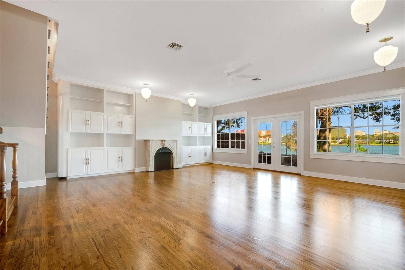 155 LAKE MORTON DRIVE, #2, Lakeland, FL 33801 The main living area & dining room combination . There are plenty of built-ins for display & storage ...along with a spectacular view of Lake Morton and downtown Lakeland .