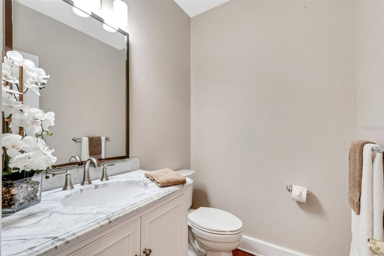 155 LAKE MORTON DRIVE, #2, Lakeland, FL 33801 Downstairs half bath is located just off the kitchen .
