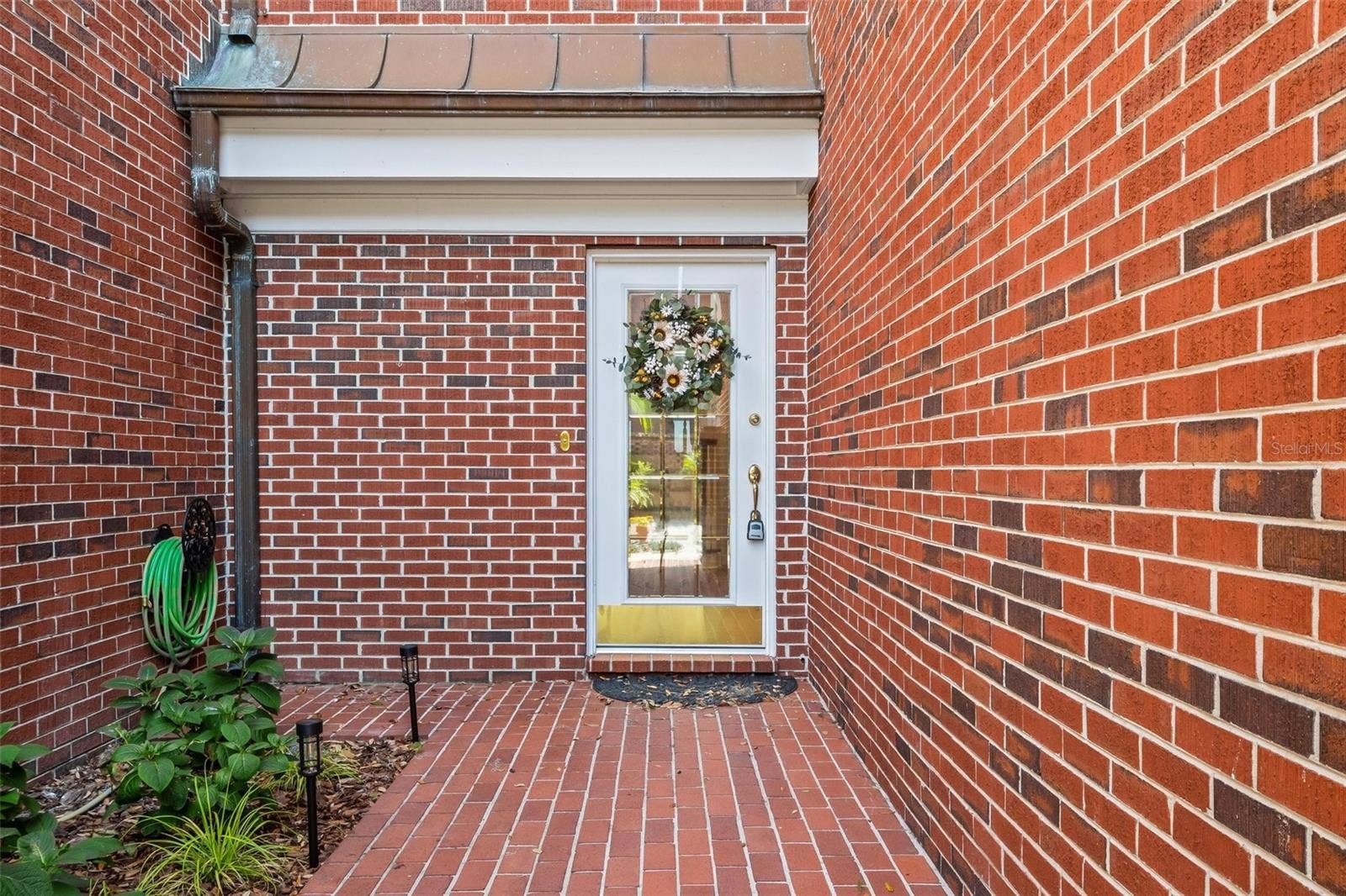 155 LAKE MORTON DRIVE, #2, Lakeland, FL 33801 Rear courtyard entry with small real patio