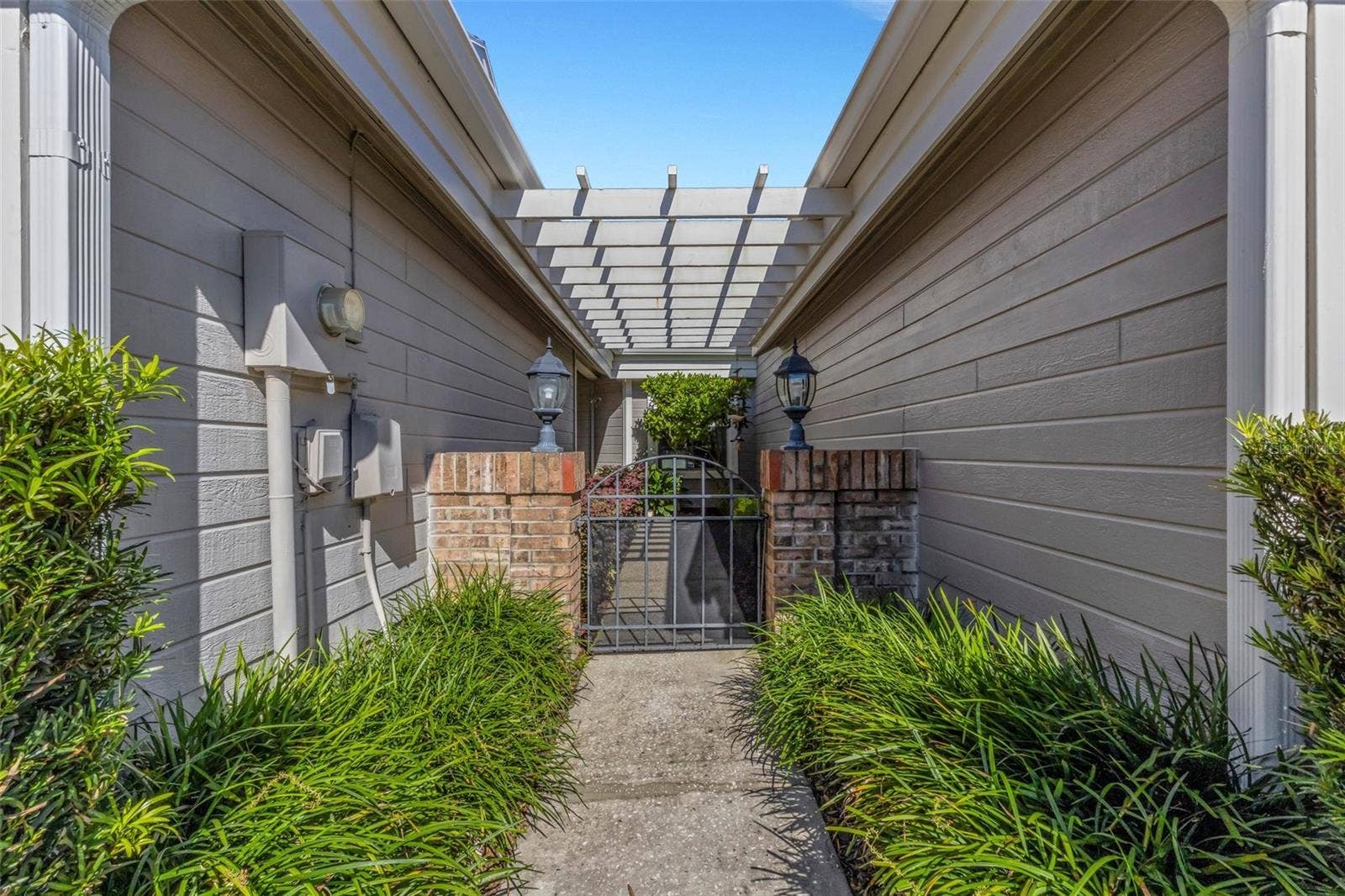 1113 WATERFALL LANE, Lakeland, FL 33803 where through the courtyard gate something special awaits.