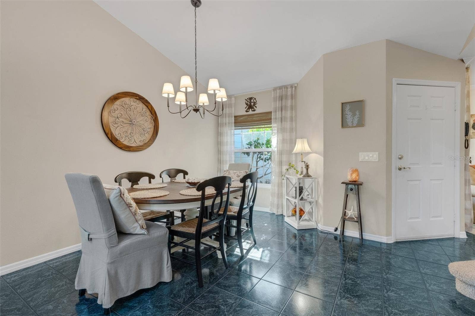 1113 WATERFALL LANE, Lakeland, FL 33803 Step inside to the spacious dining & living room combo space decked out in easy care tile flooring.